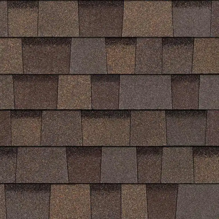 Close-up of overlapping textured brown asphalt roof shingles in a uniform pattern.