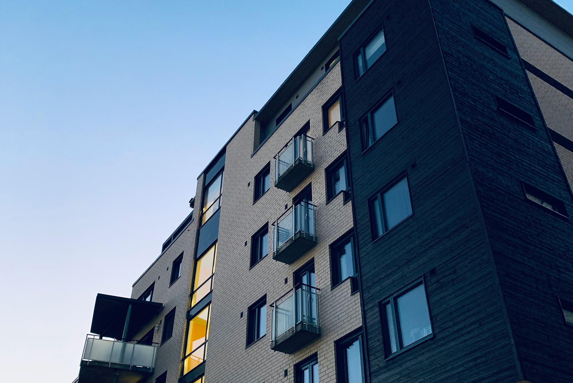 Building with dark exterior and blue sky