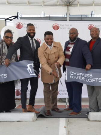 Ribbon-cutting ceremony with a crowd