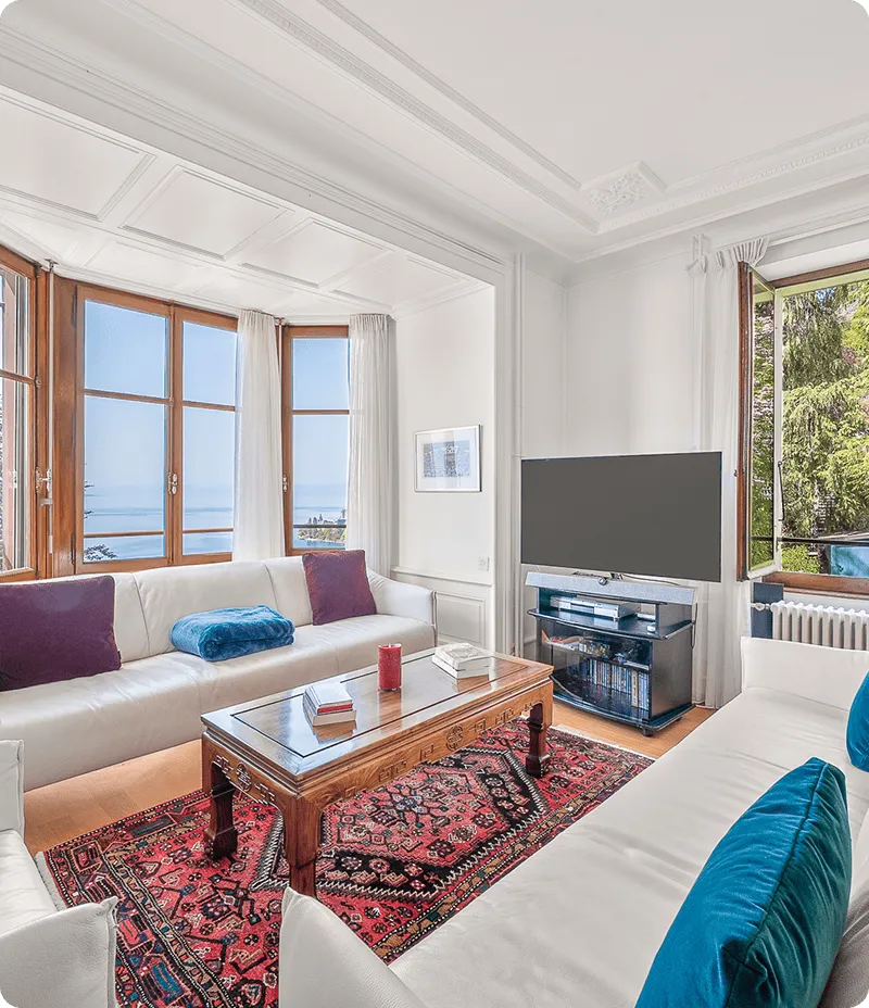 Salon lumineux d’un bien haut de gamme proposé par notre agence immobilière à Montreux