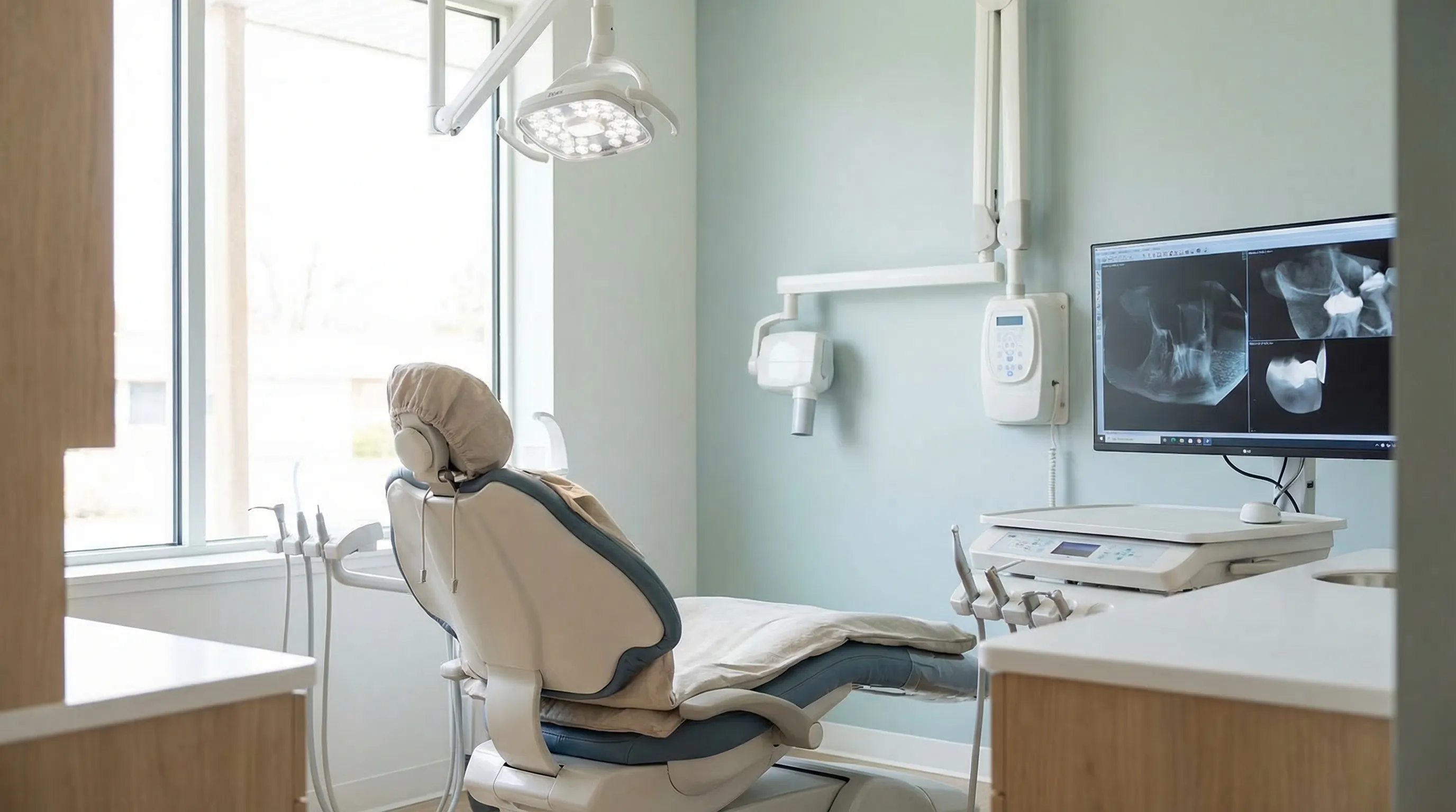 Modern dental practice interior in Cleveland Heights, OH with professional dentist and patient