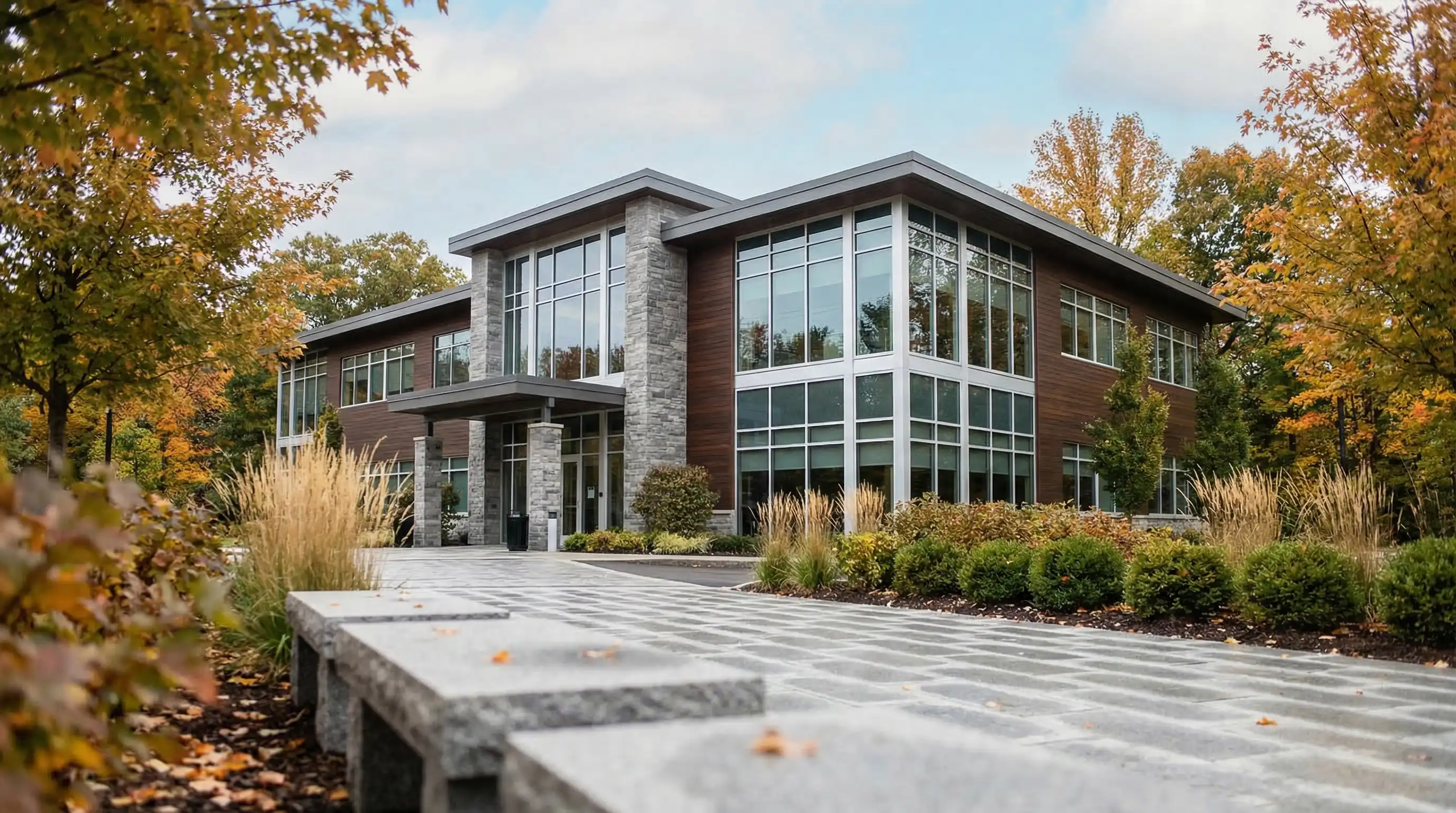 Financial advisor reviewing a retirement portfolio with clients in a professional office in Buffalo, NY