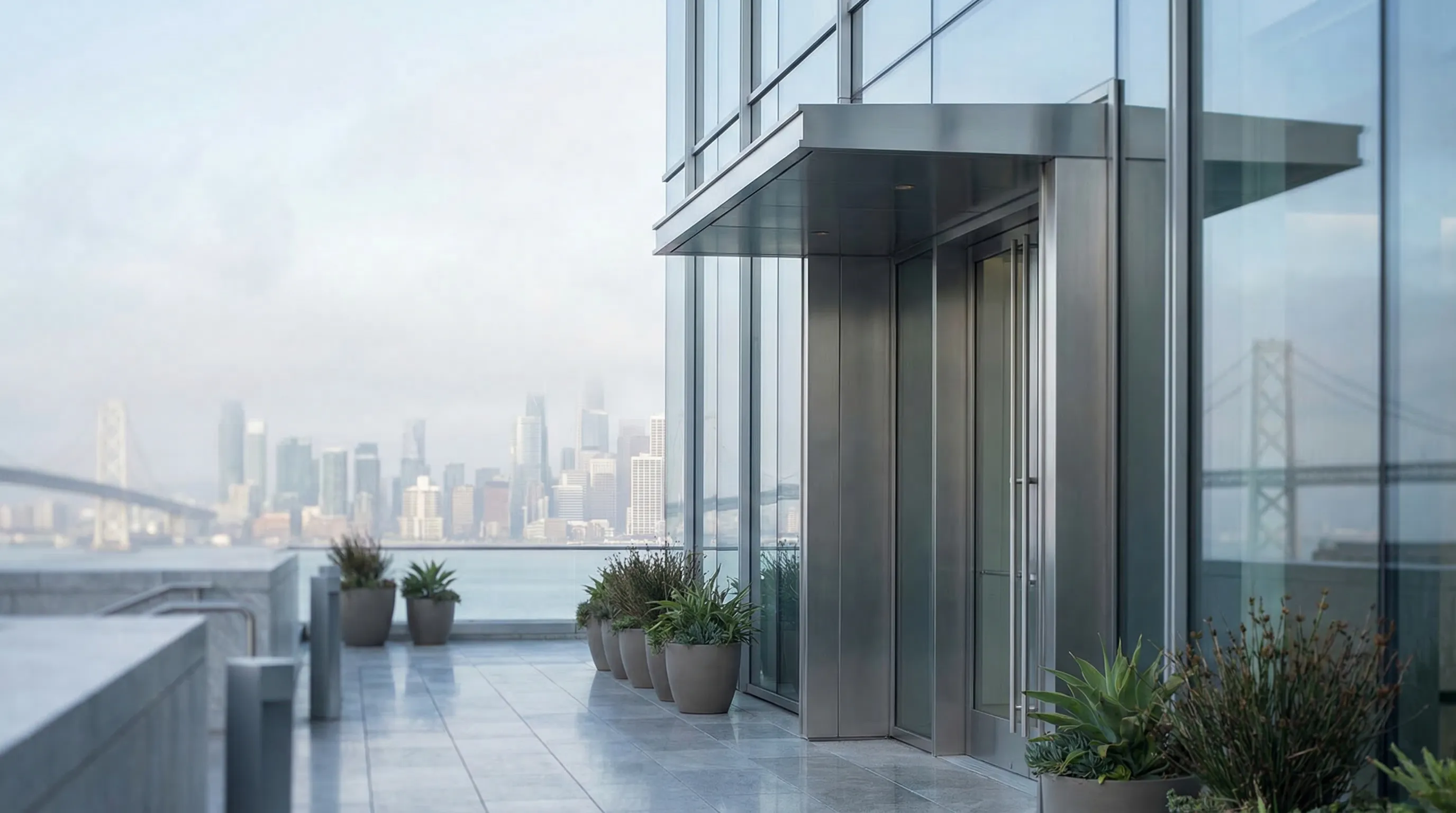 Modern San Francisco financial advisory office interior with advisor and tech professional client reviewing financial plan at a table, floor-to-ceiling windows with SF Bay Bridge view