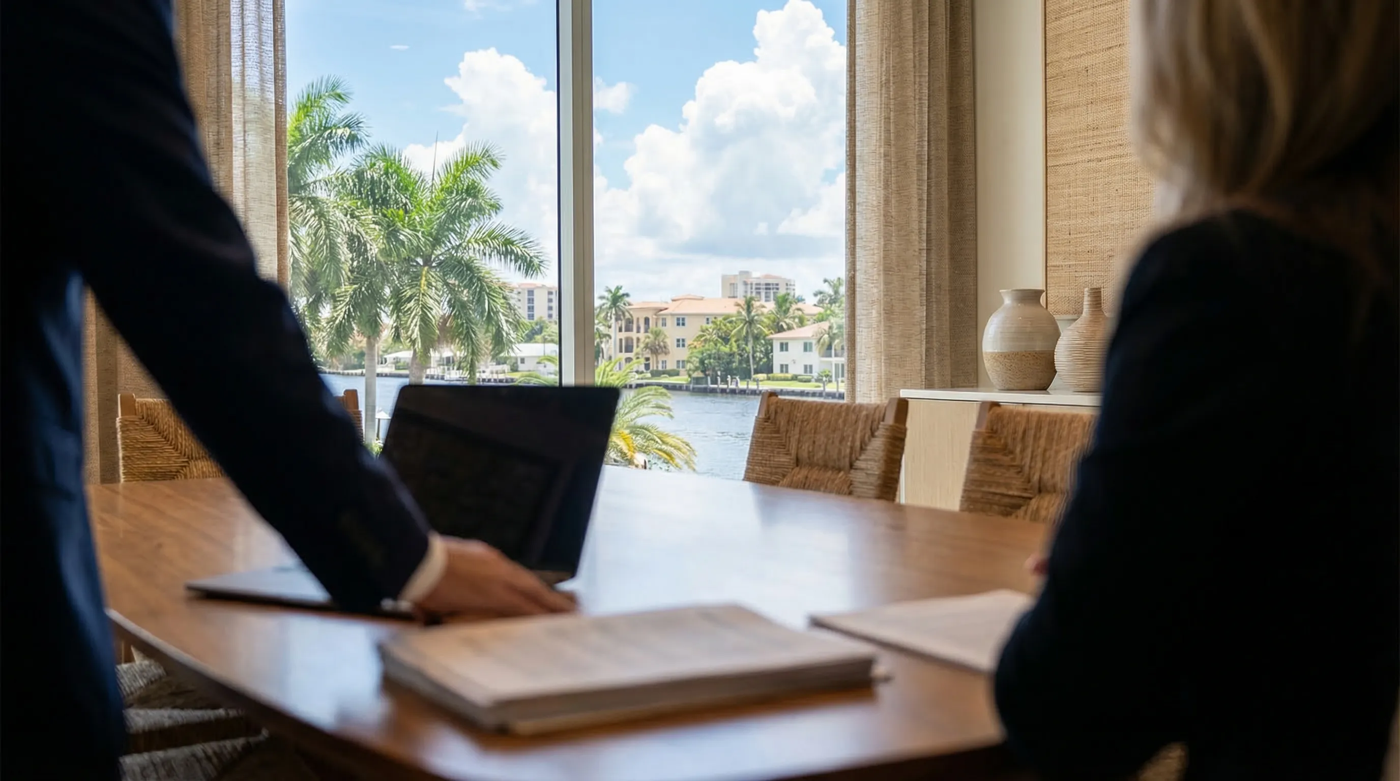 Professional attorney meeting with a client in a modern law firm office in Fort Lauderdale, FL