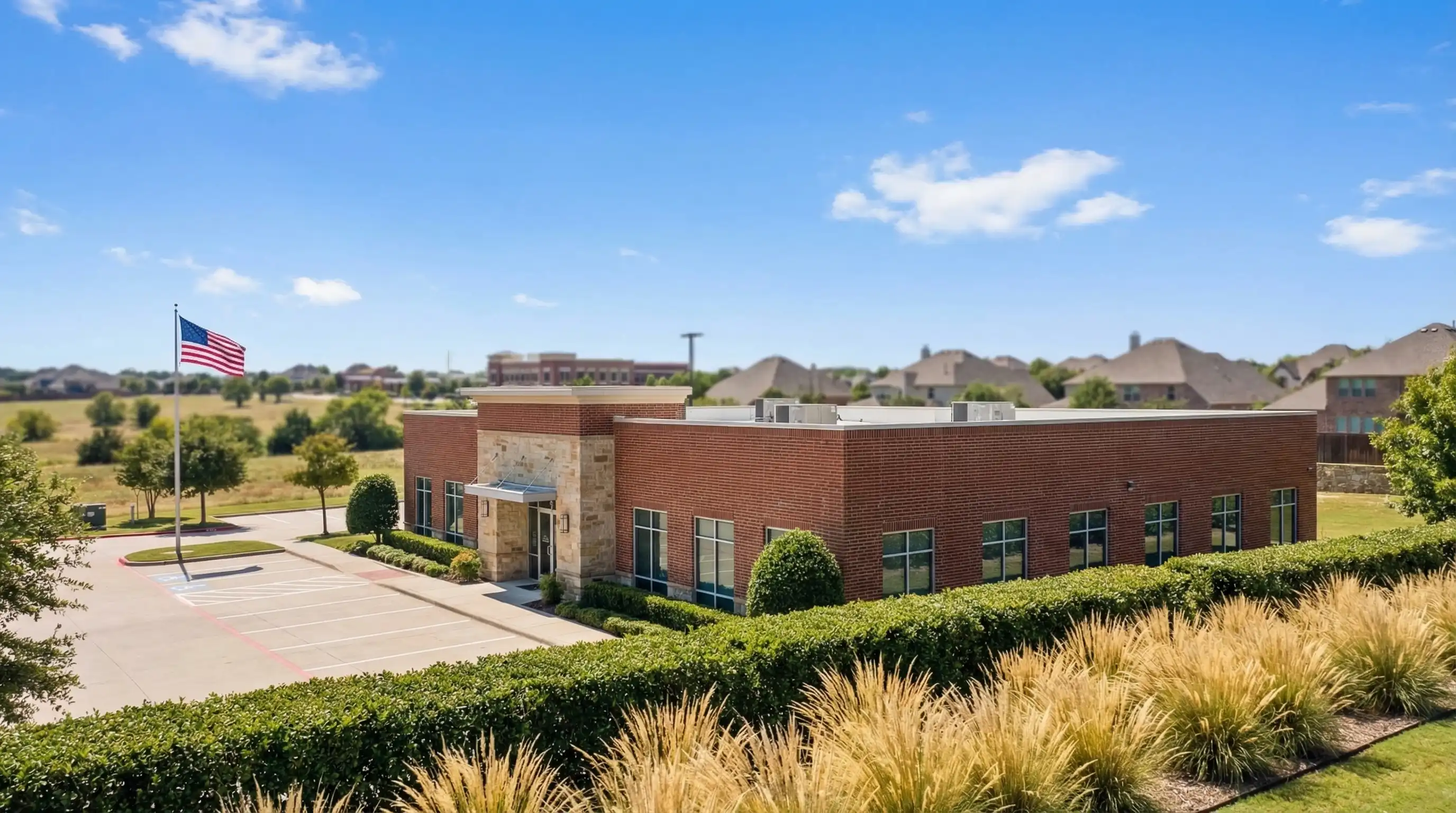 Professional law office consultation room in McKinney, TX with polished conference table, law volumes, and natural light