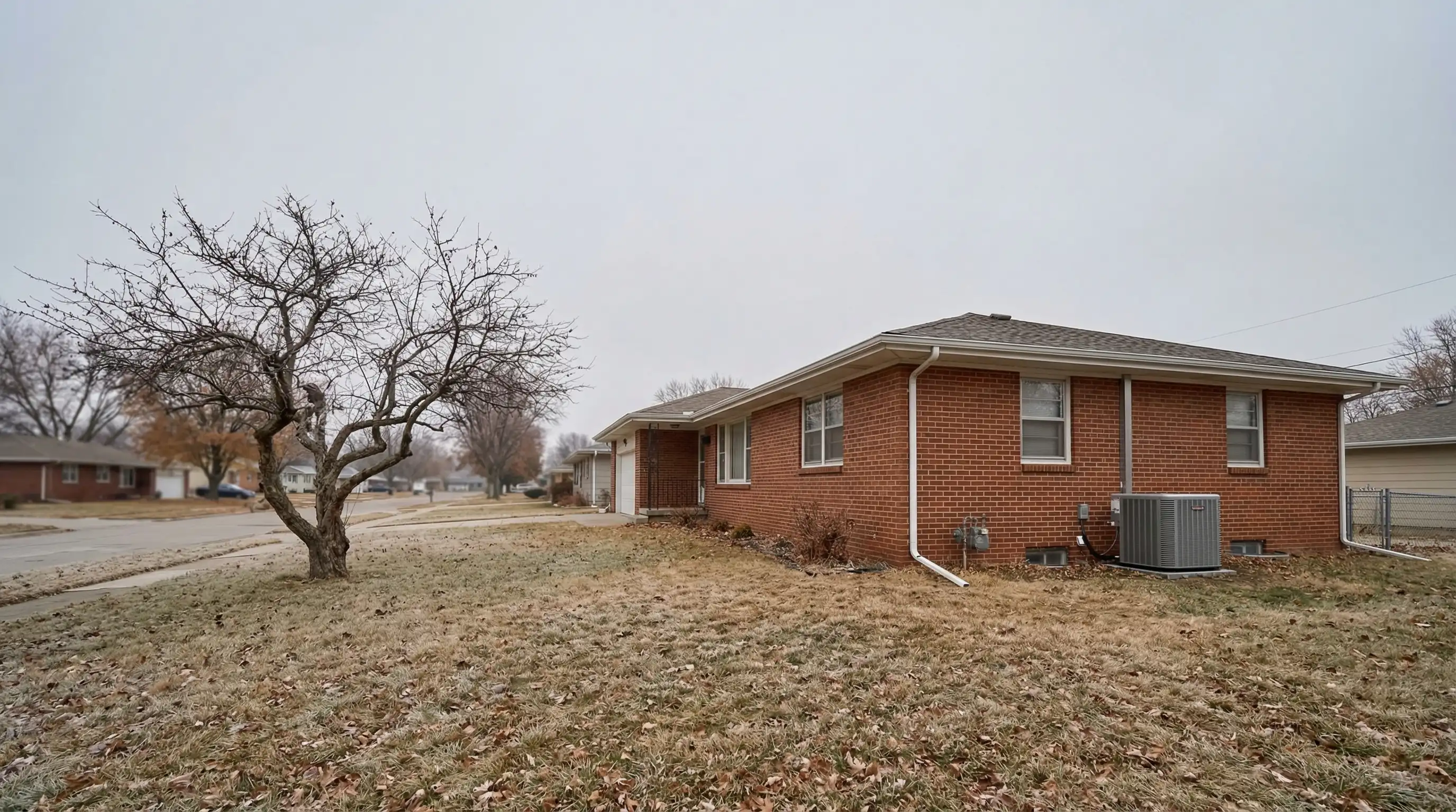 Professional HVAC technician servicing a furnace in a Lincoln, NE residential home basement