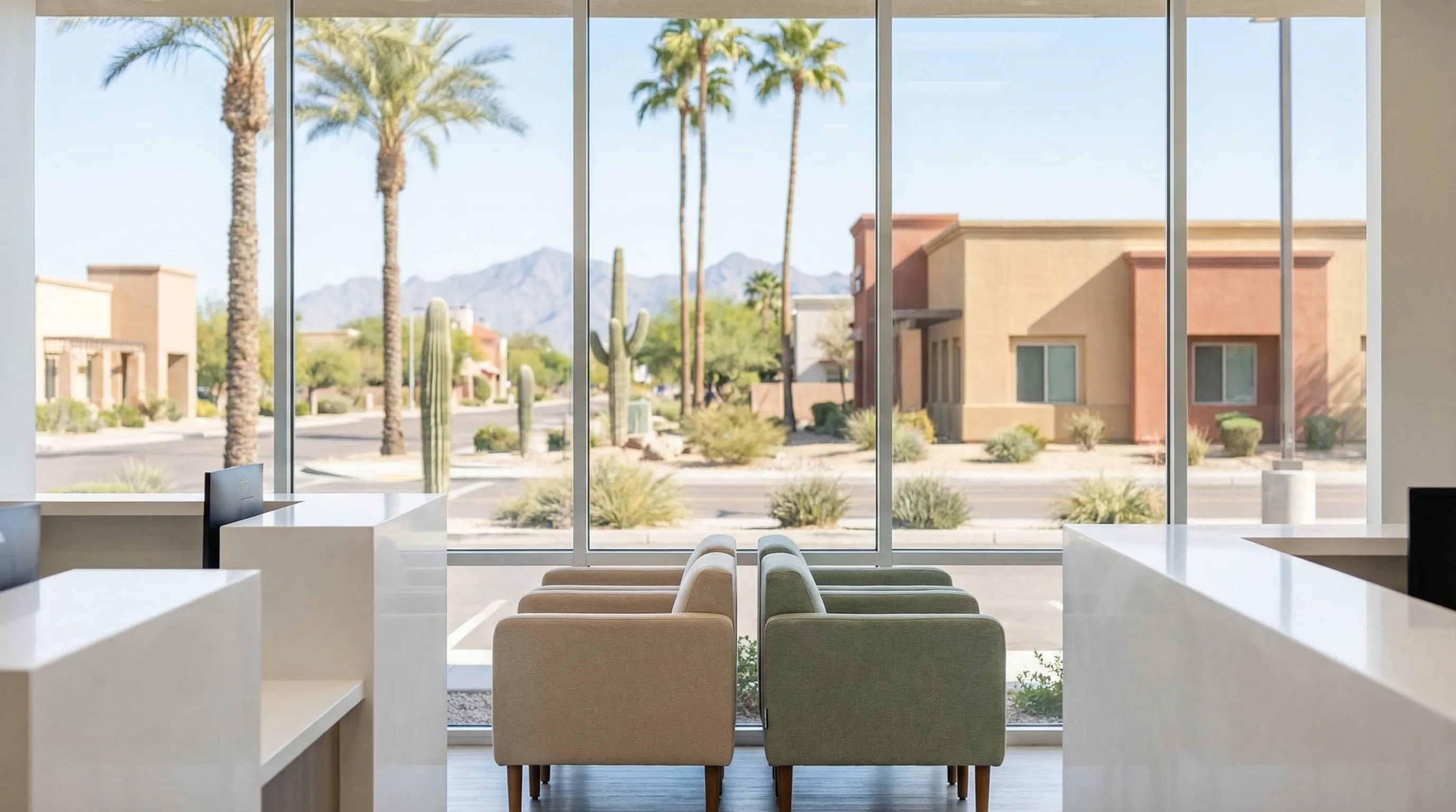 Professional dentist examining a patient in a modern dental practice in Glendale, AZ with warm desert-tone interior