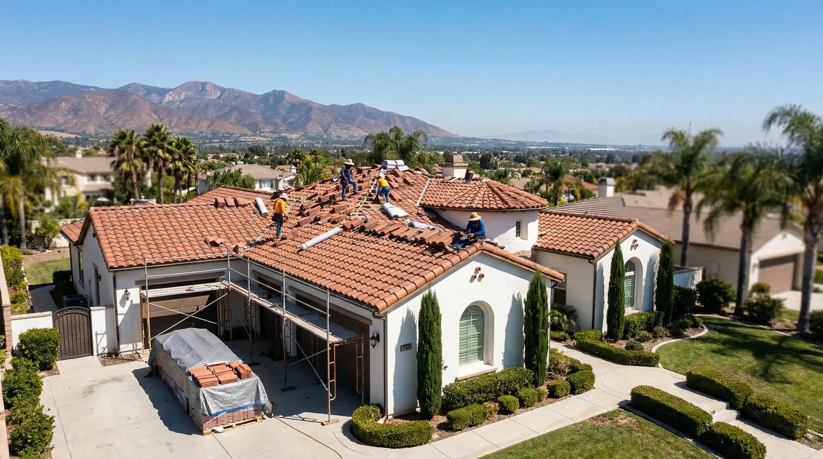 Licensed roofing contractor inspecting Spanish clay tile roof on a residential home in Anaheim Hills, CA