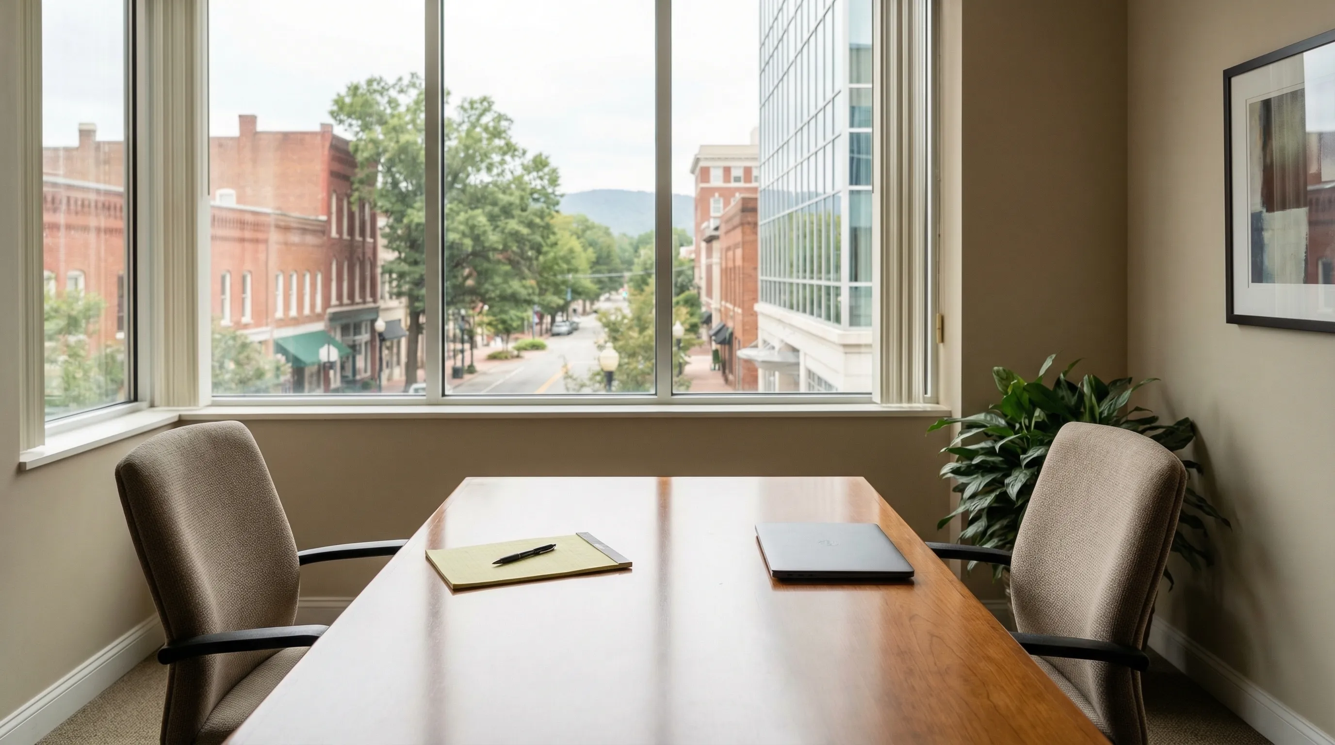 Winston-Salem law office consultation room with courthouse view and professional interior for legal PPC services in Forsyth County, NC