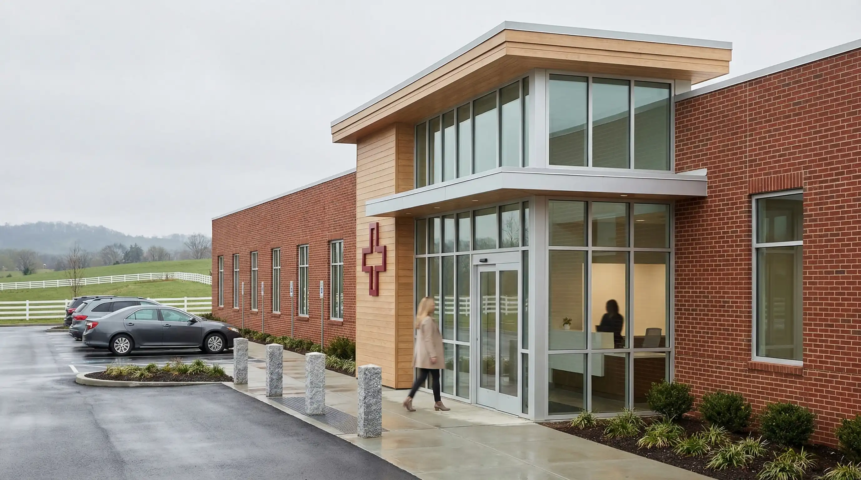 Modern independent healthcare clinic exterior with a welcoming entrance in Lexington, KY, physician visible through glass window