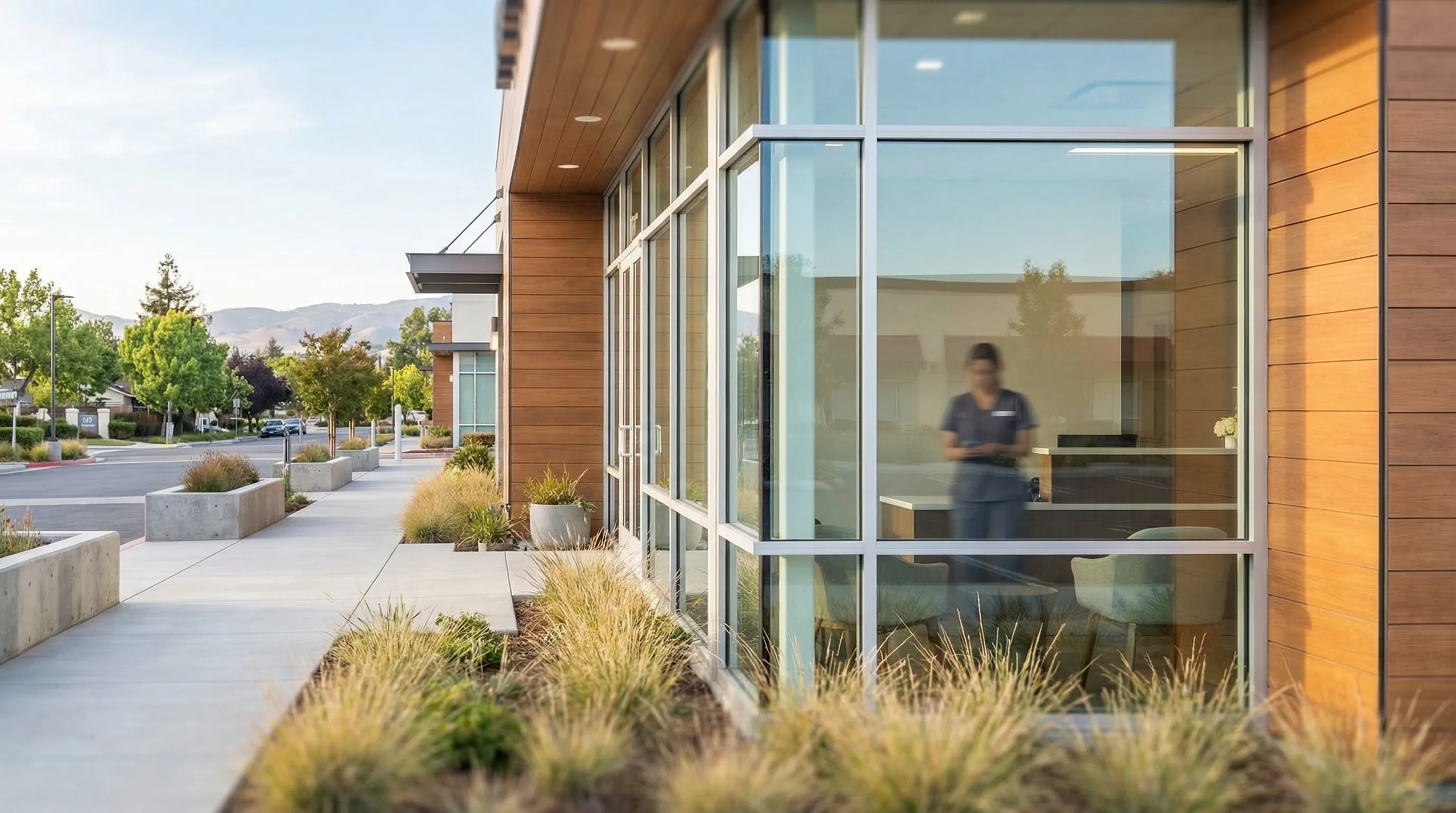 Dental hygienist performing a professional cleaning for a patient at a modern dental practice in Fremont, CA