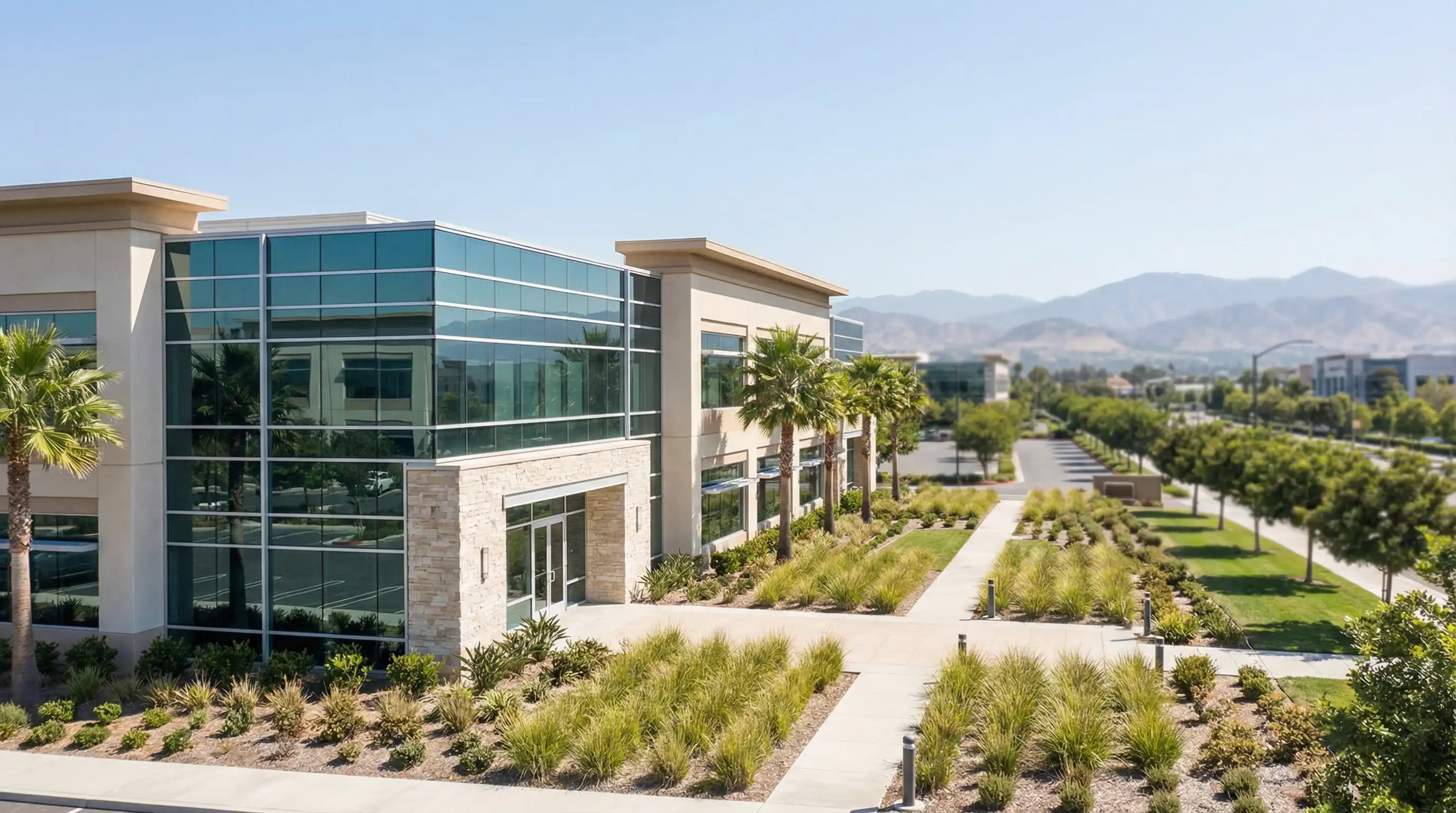 Financial advisor meeting with client in modern Irvine, CA office reviewing investment portfolio