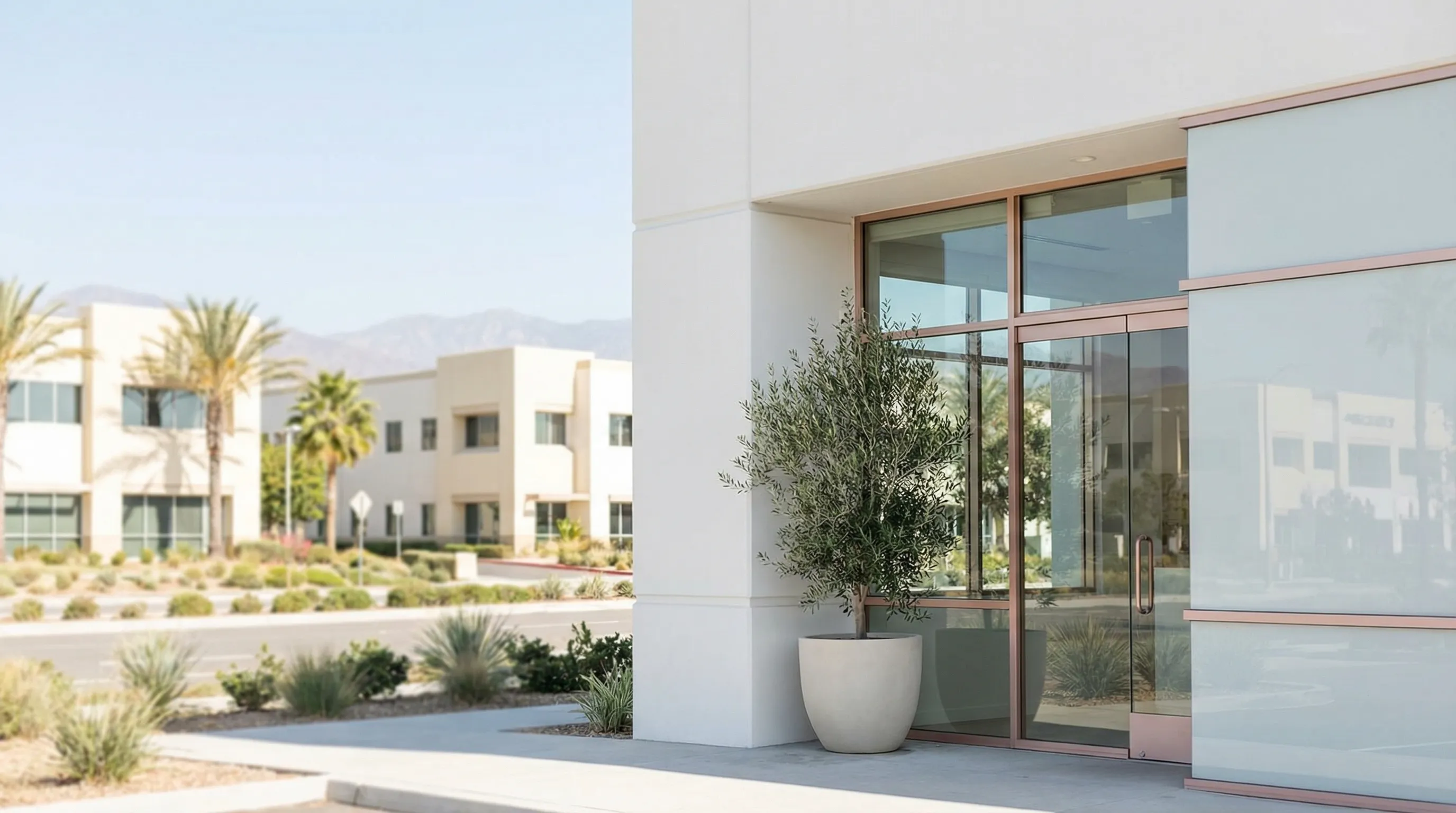 Modern medical spa treatment room interior in Irvine, CA with provider and patient during injectable consultation