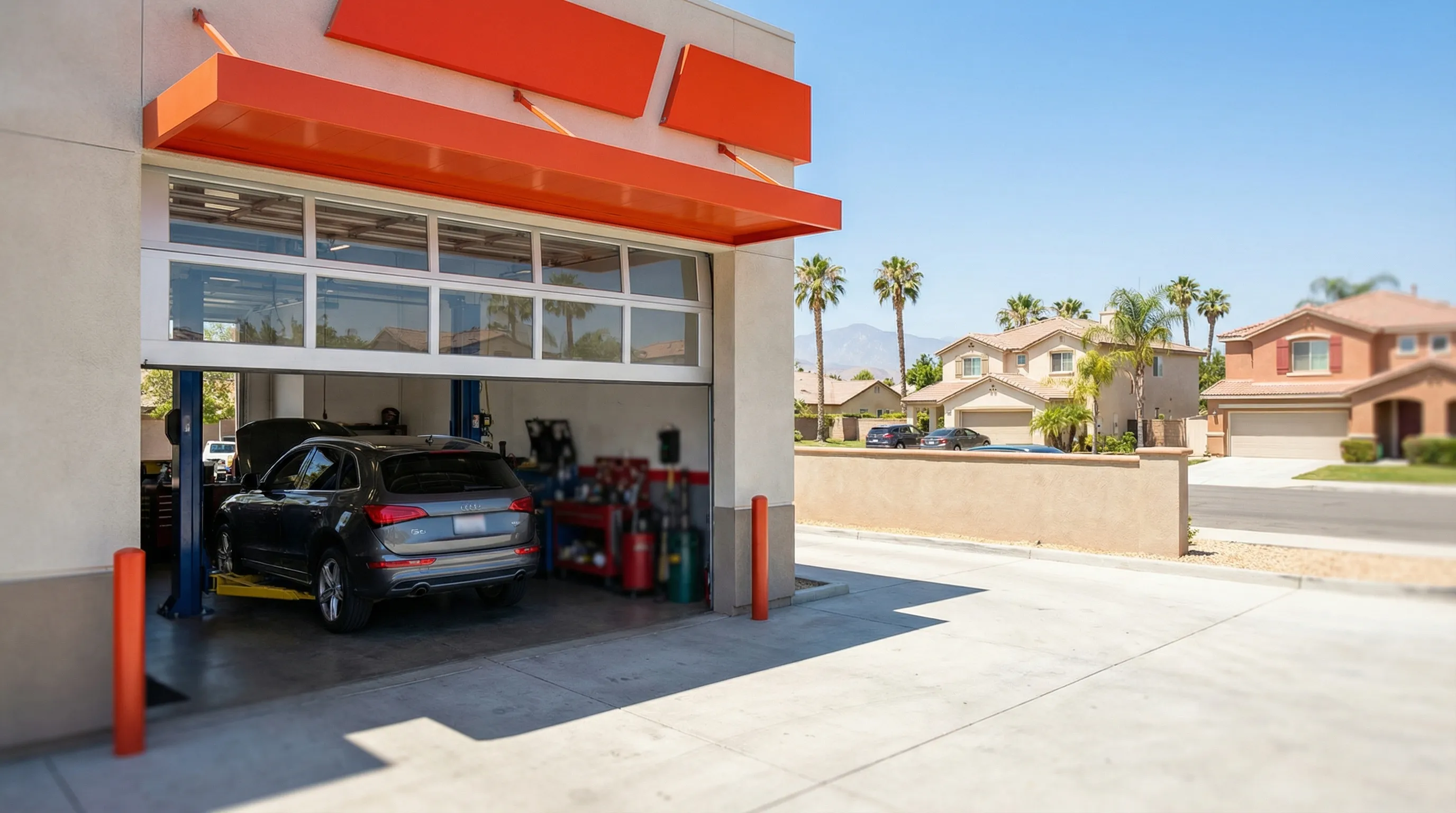 Professional auto mechanic working in a service bay at an independent repair shop in Santa Ana, CA