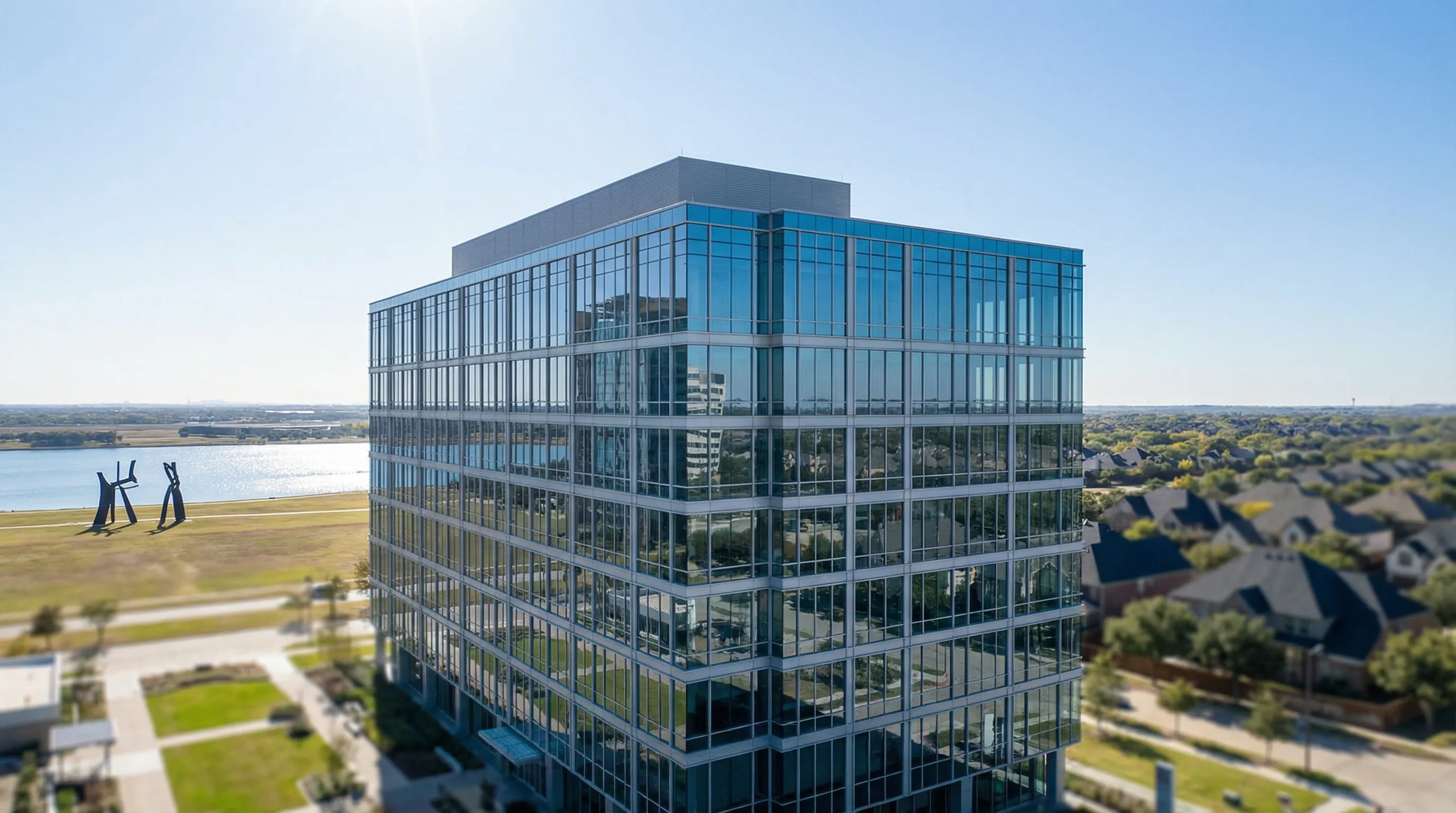 Professional financial advisor consulting with executive client in Las Colinas office building, Irving, TX