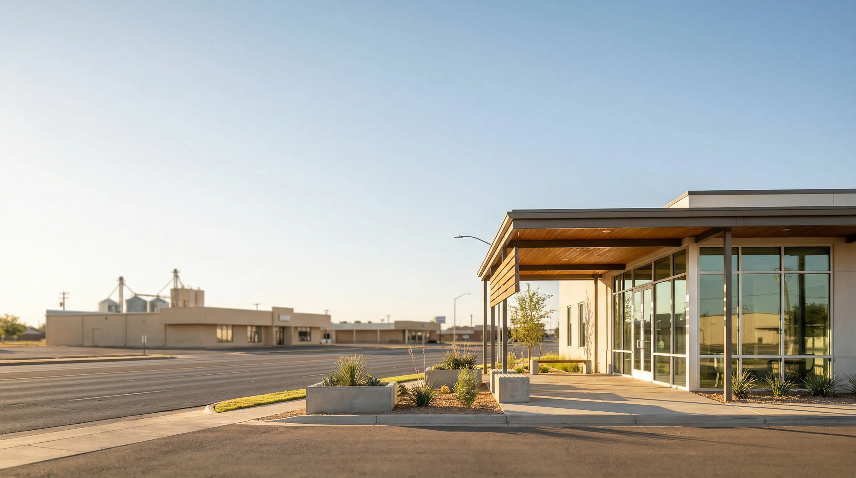 Modern dental practice interior in Lubbock, TX with a dentist using digital imaging equipment to examine a patient in a bright, professional clinical setting