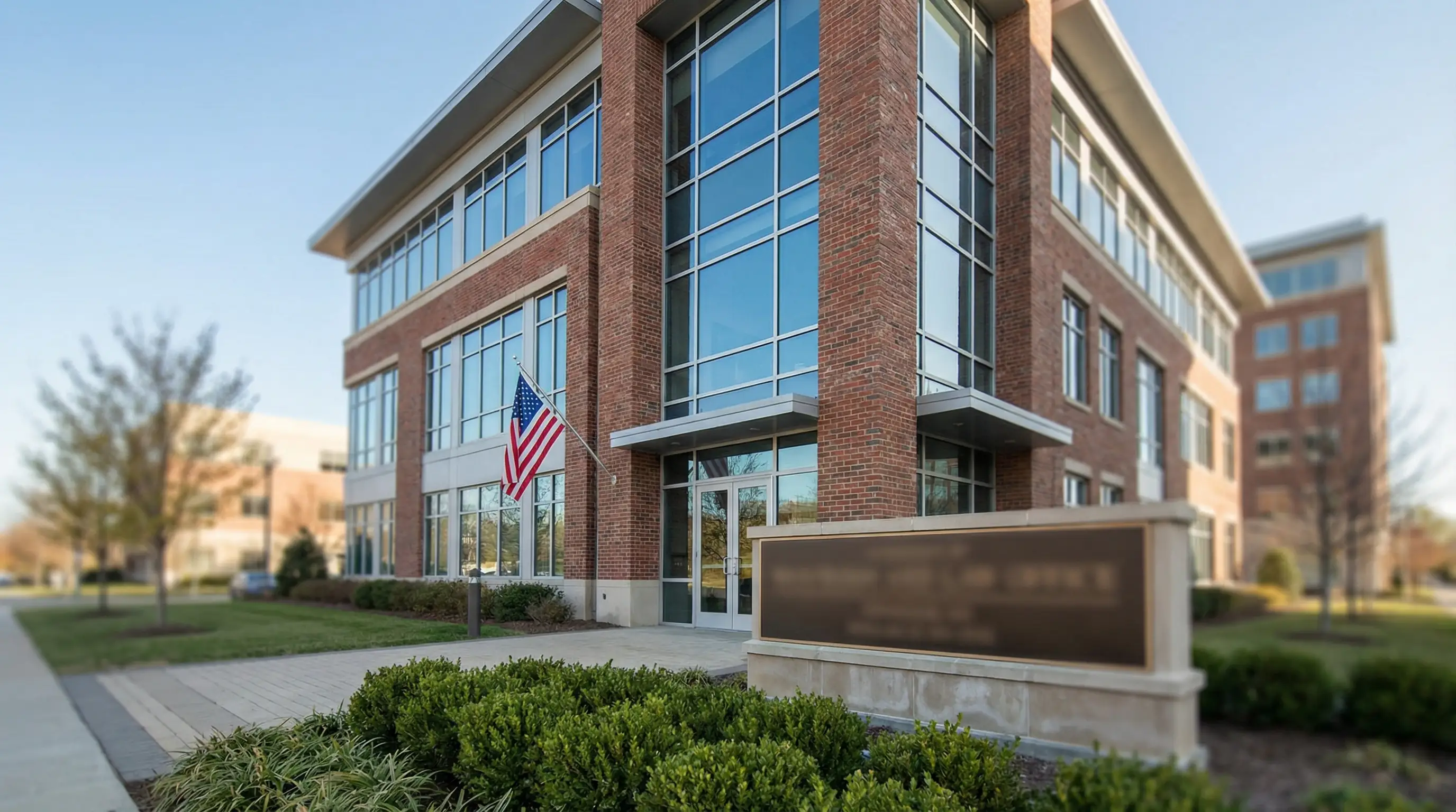 Attorney in professional attire reviewing documents with a Navy service member in a Norfolk law office consultation room