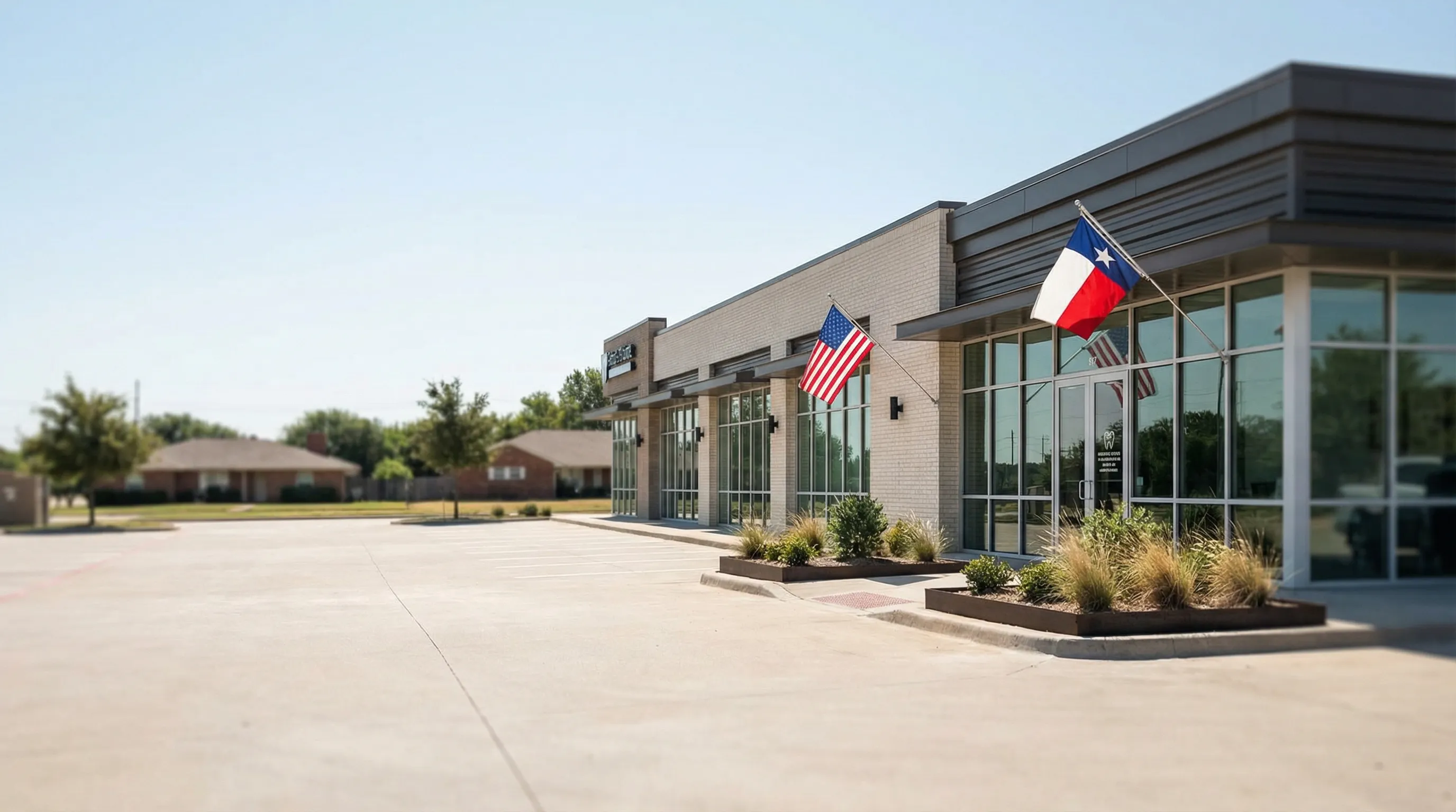 Professional dental operatory in a Garland, TX practice with bilingual patient intake materials and digital X-ray display