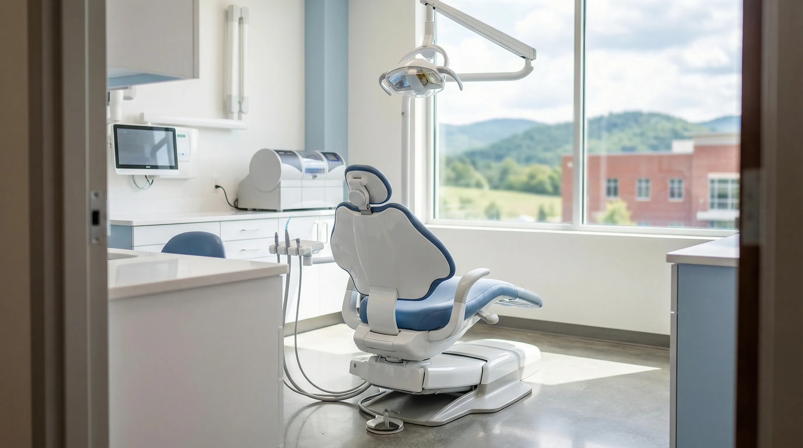 Modern dental operatory with a dentist and patient at a Birmingham, AL dental practice