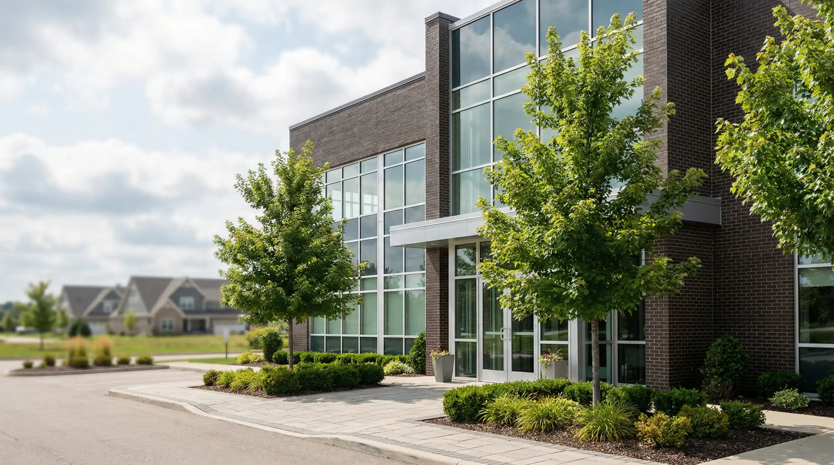 Modern dental practice interior in Grand Rapids, MI — smiling hygienist with patient, bright clean operatory