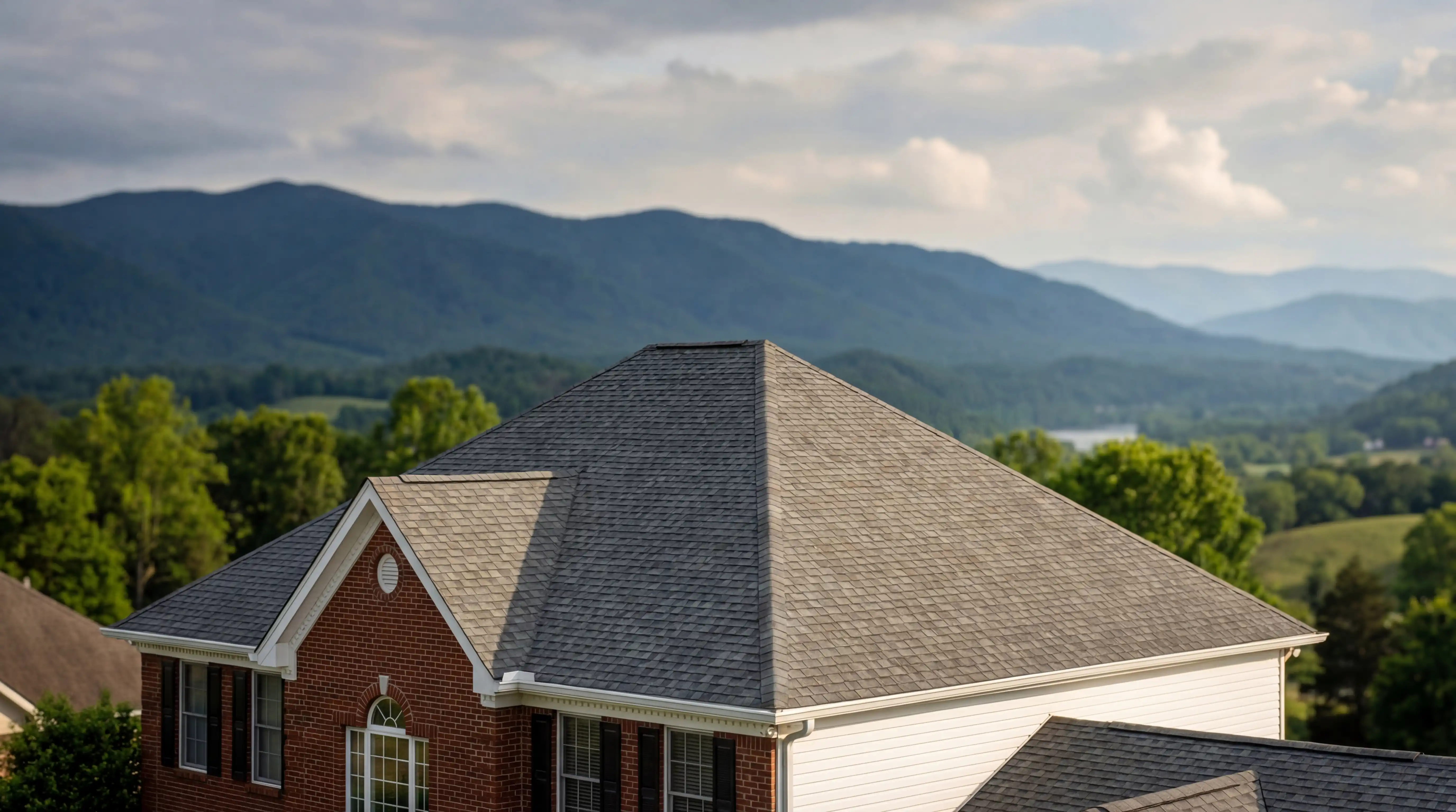 Professional roofing contractor inspecting residential roof in Farragut, Knox County, Tennessee with Great Smoky Mountains foothills visible in background