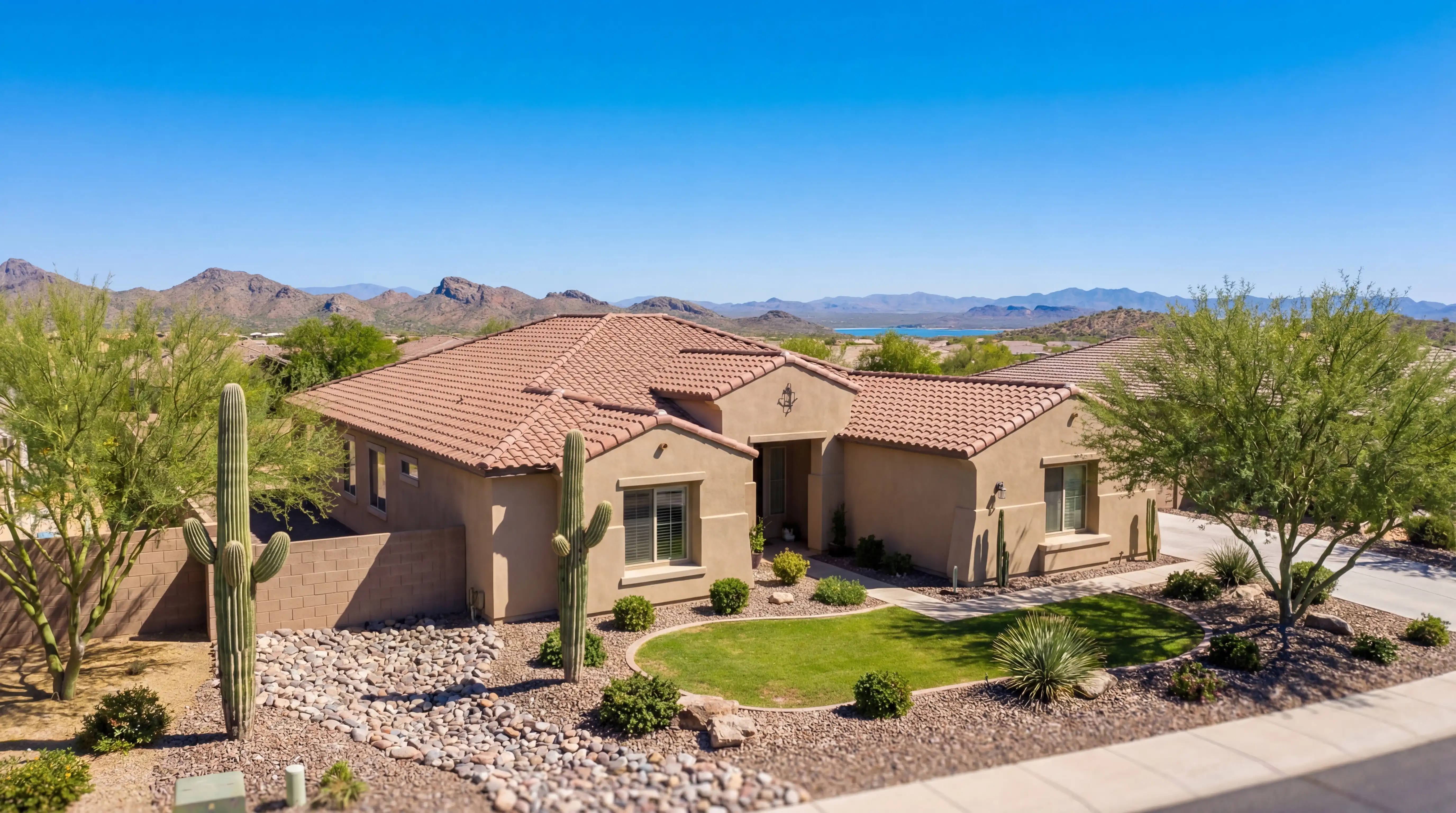 Real estate agent showing modern home exterior to buyers in Peoria, AZ