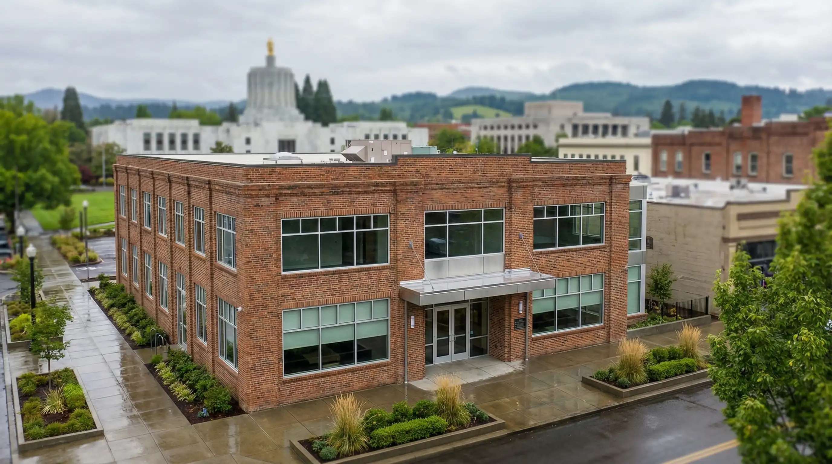 Professional CPA at a desk reviewing business financial statements with a Salem, OR small business owner client