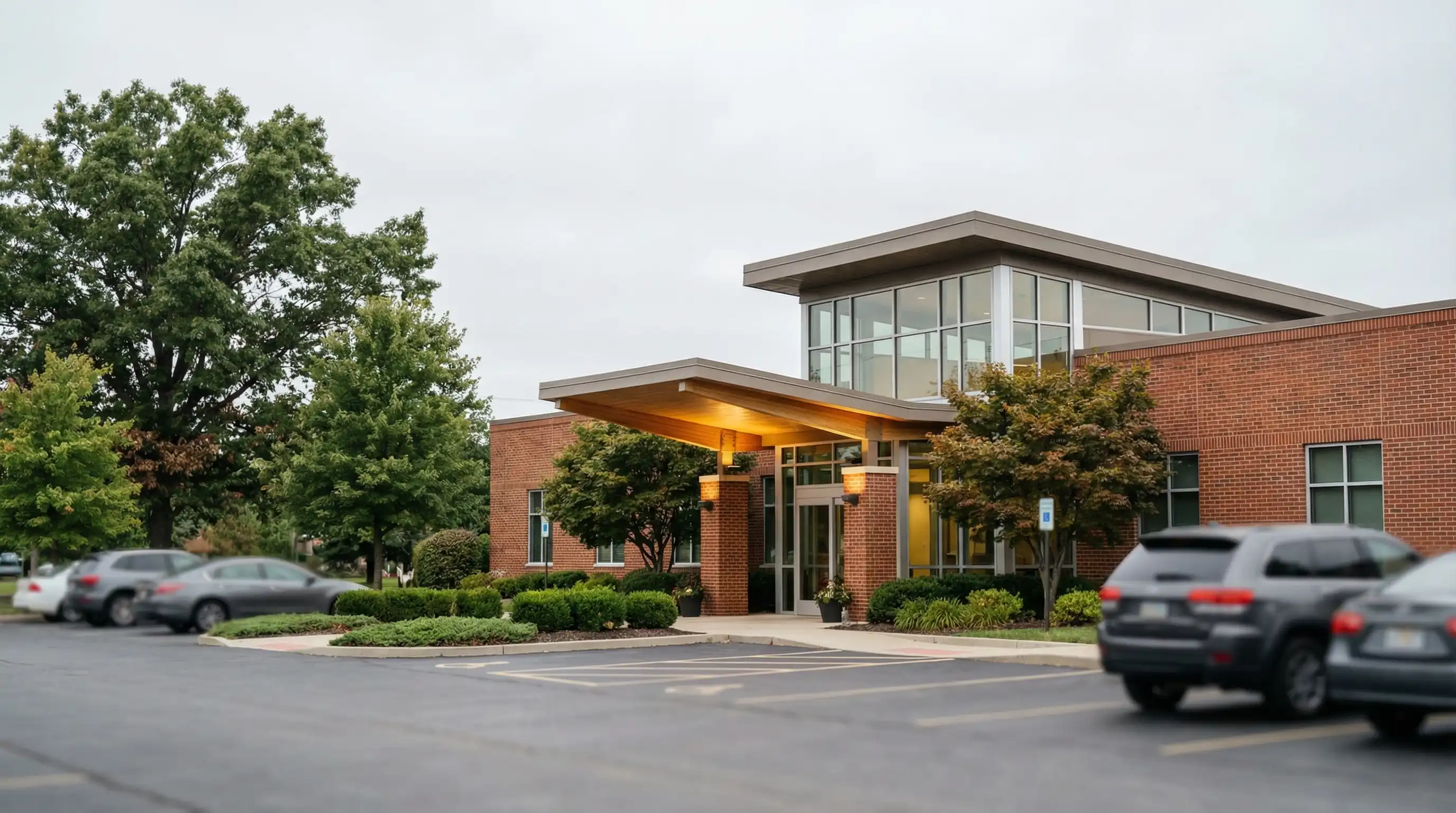 Dentist examining patient in modern dental office in Dayton, OH suburban practice setting