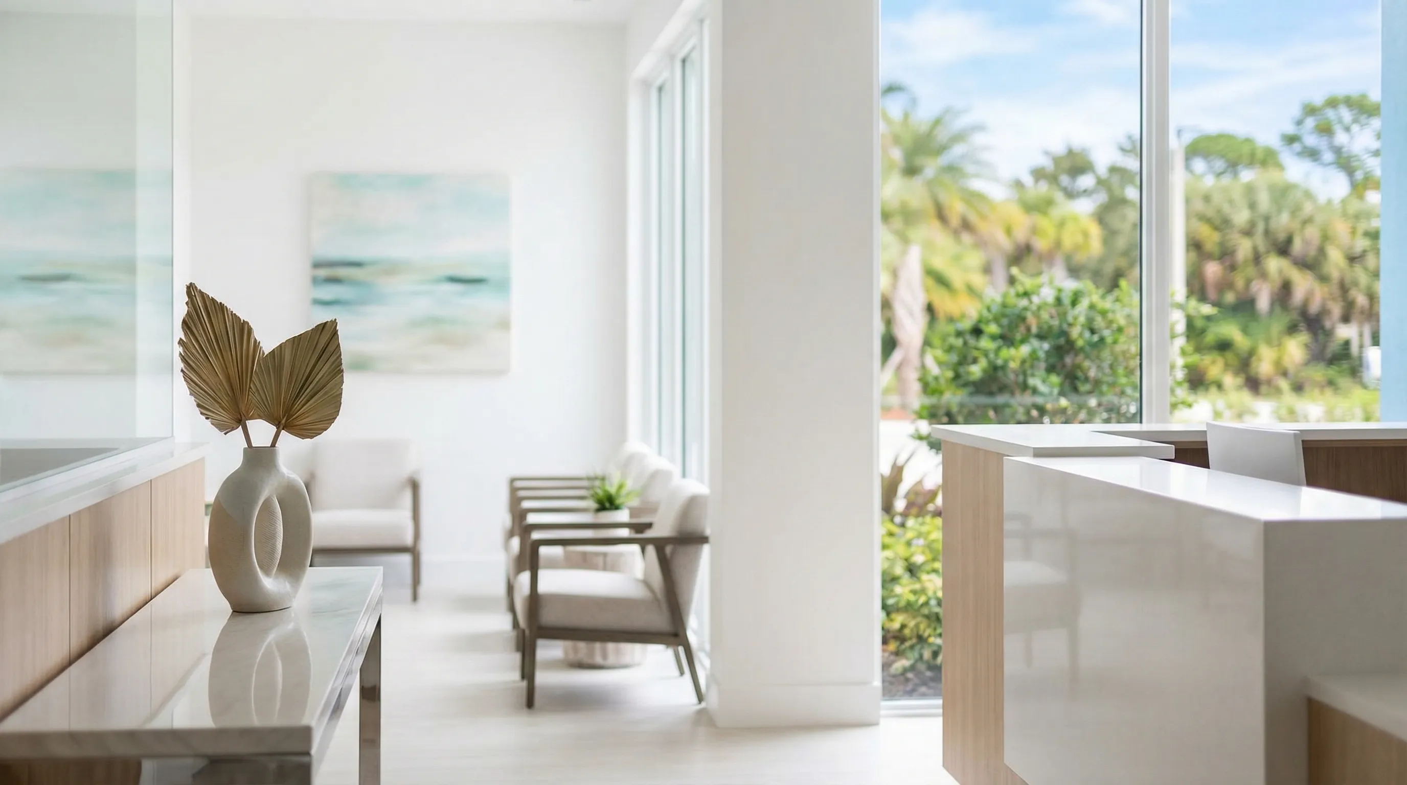 Professional dental reception area in Cape Coral, FL — modern coastal office with natural light and a welcoming dental receptionist greeting new patients
