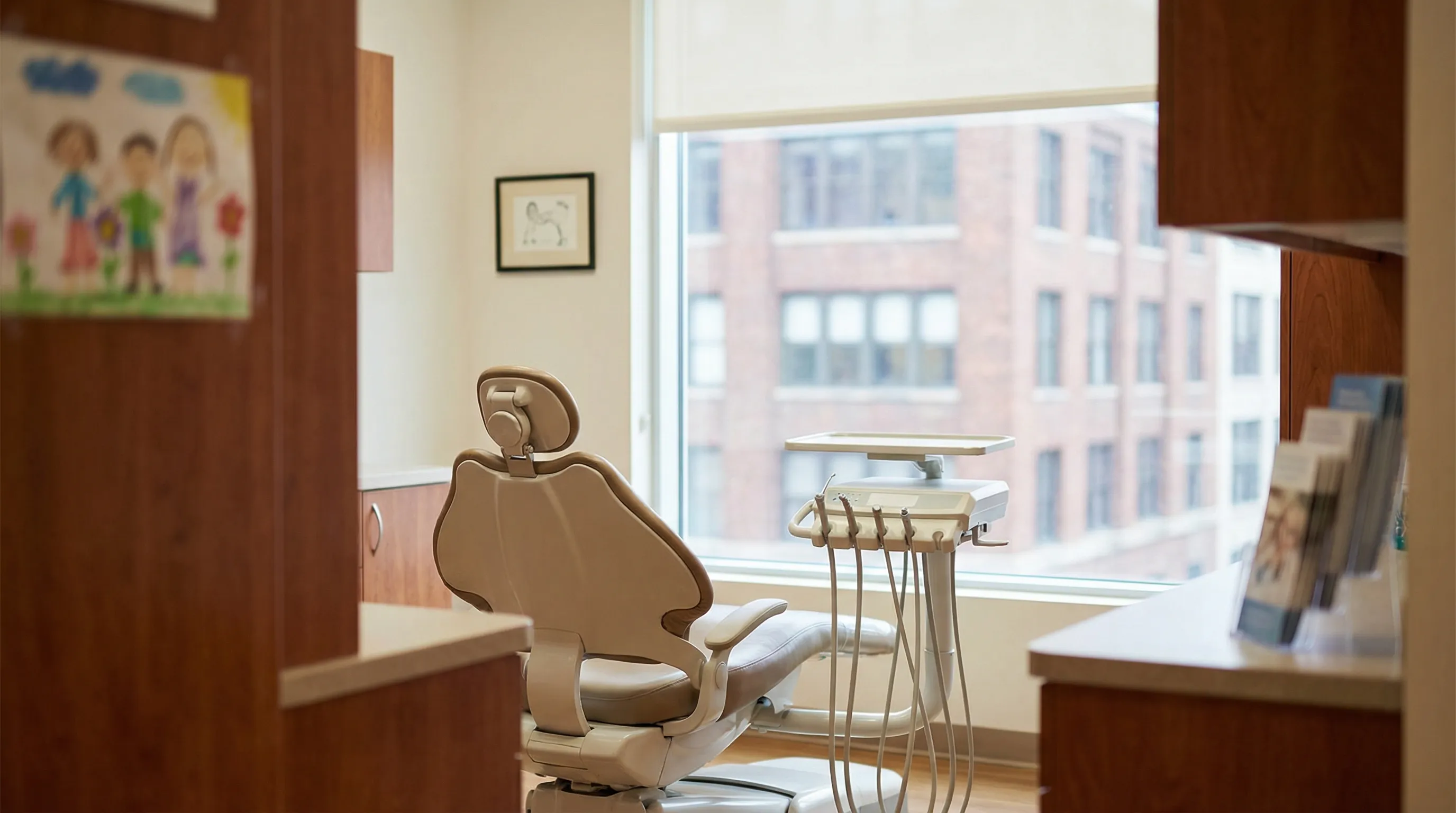 Dentist providing dental care to a young patient in a welcoming Paterson, NJ dental office
