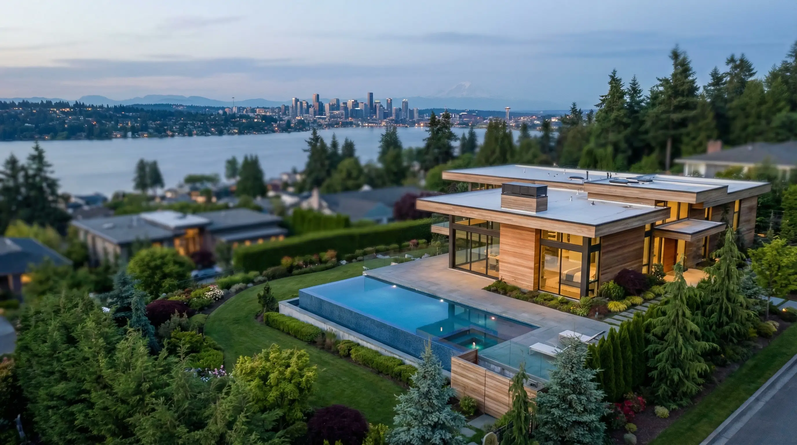 Real estate agent showing a couple through a modern open-plan Bellevue home with floor-to-ceiling windows overlooking Lake Washington