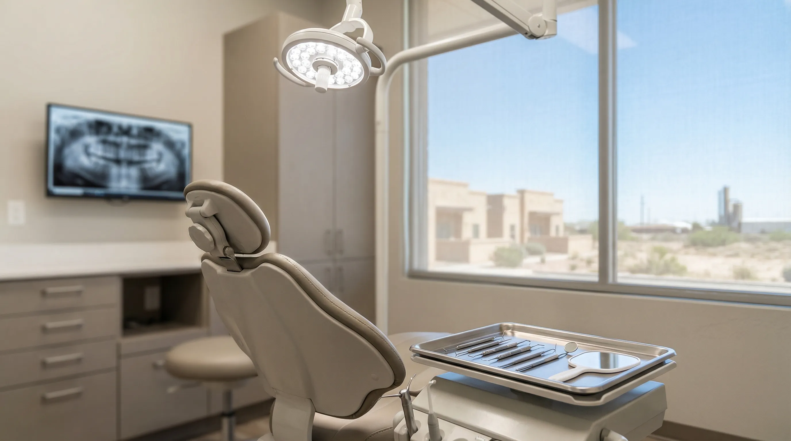Friendly dentist and dental assistant in a bright modern Midland, TX dental office welcoming a new patient at the front entrance