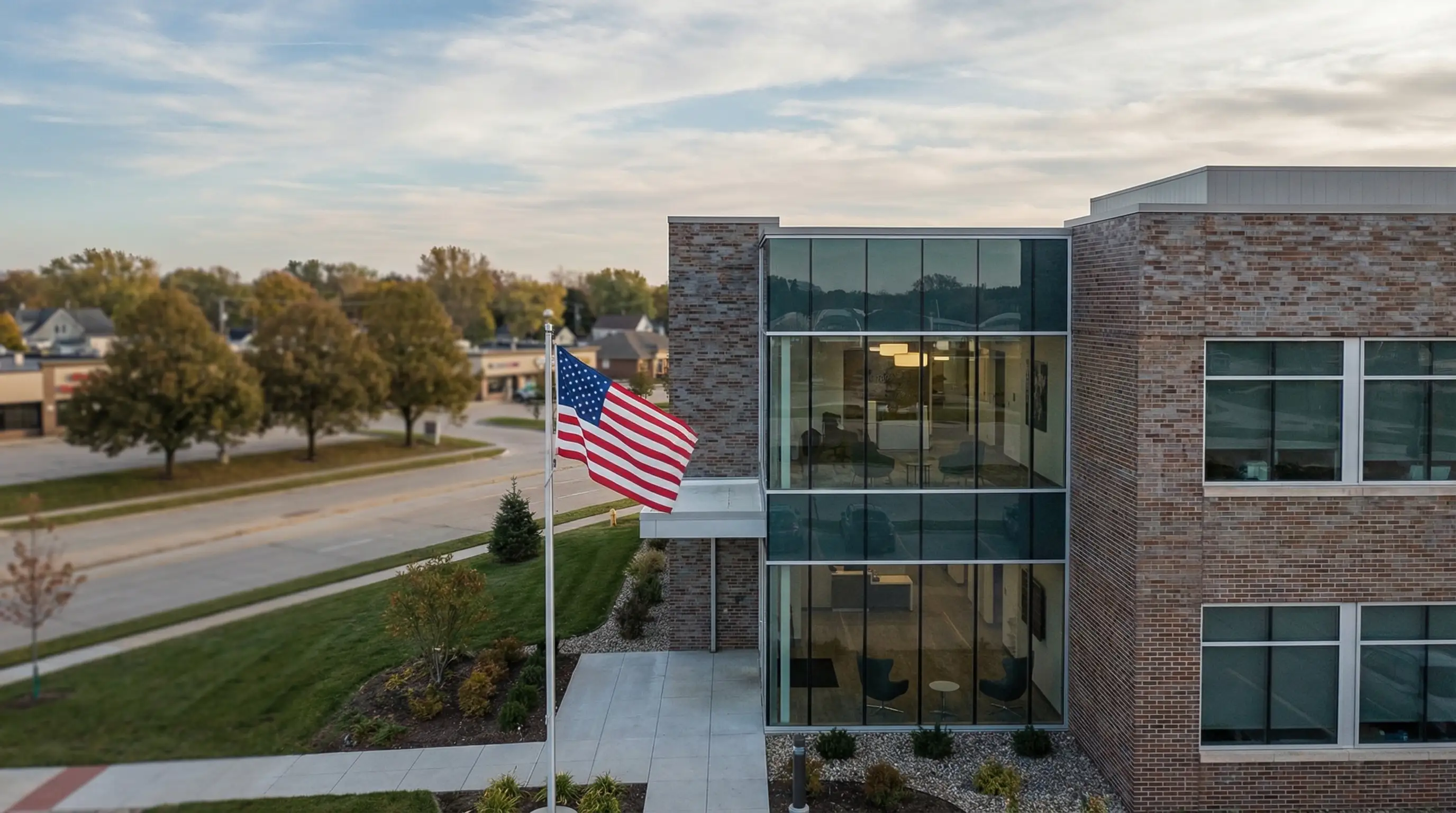 Professional attorney consulting with a client in a modern Cedar Rapids, IA law office conference room with legal documents on the table