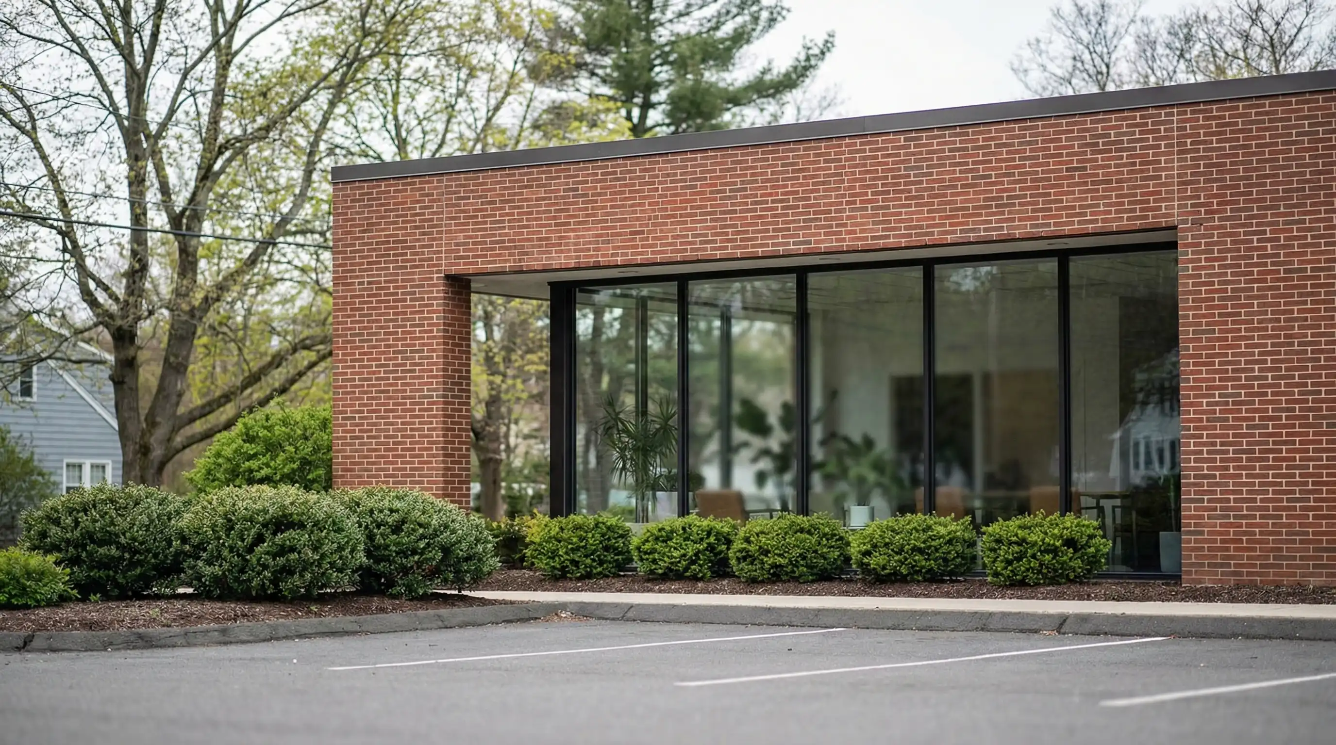Modern dental practice interior in New Haven suburban office, dentist consulting with patient in clean bright operatory room