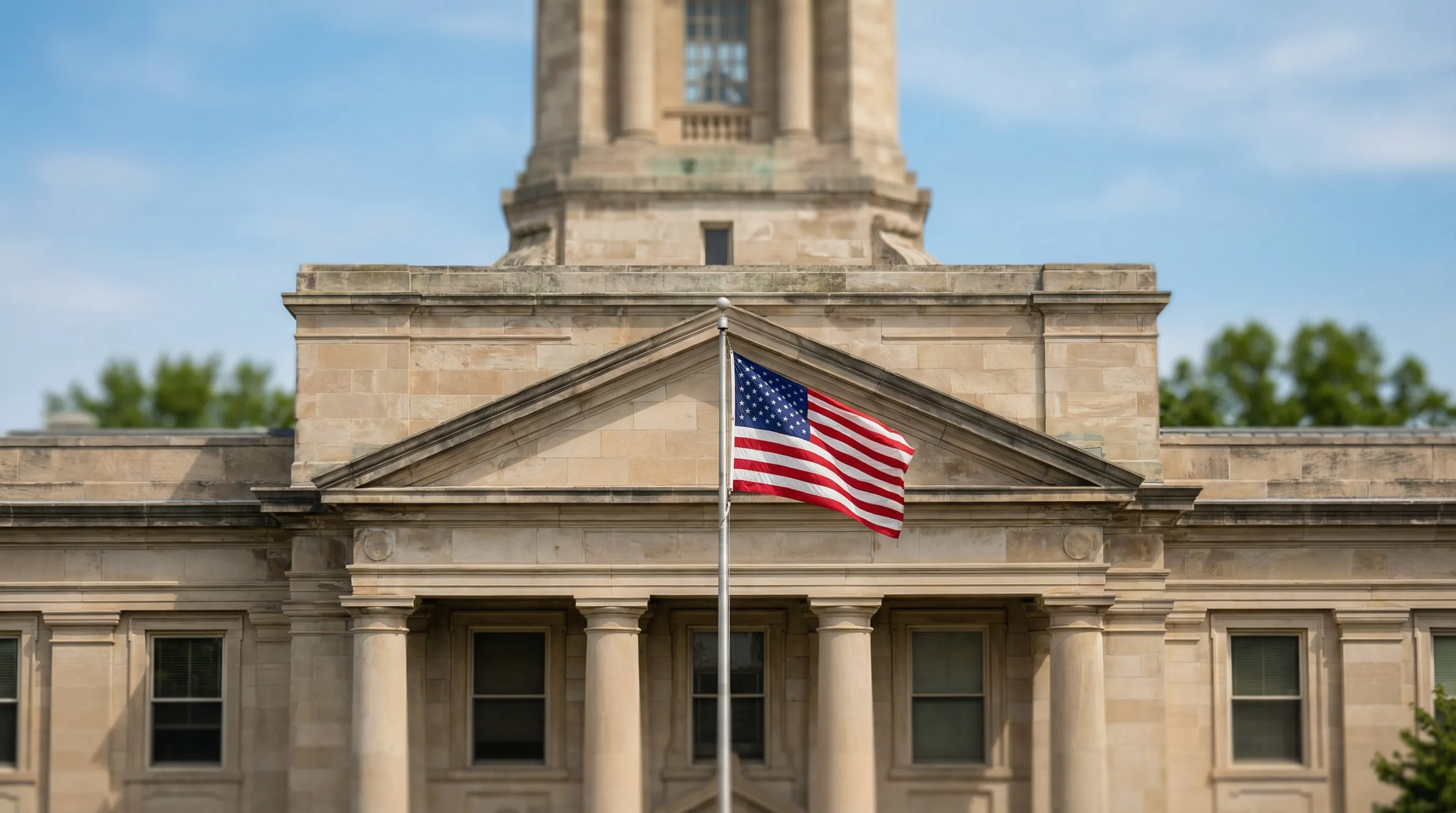 Professional attorney meeting with client in modern Evansville law office with Vanderburgh County Courthouse visible through window