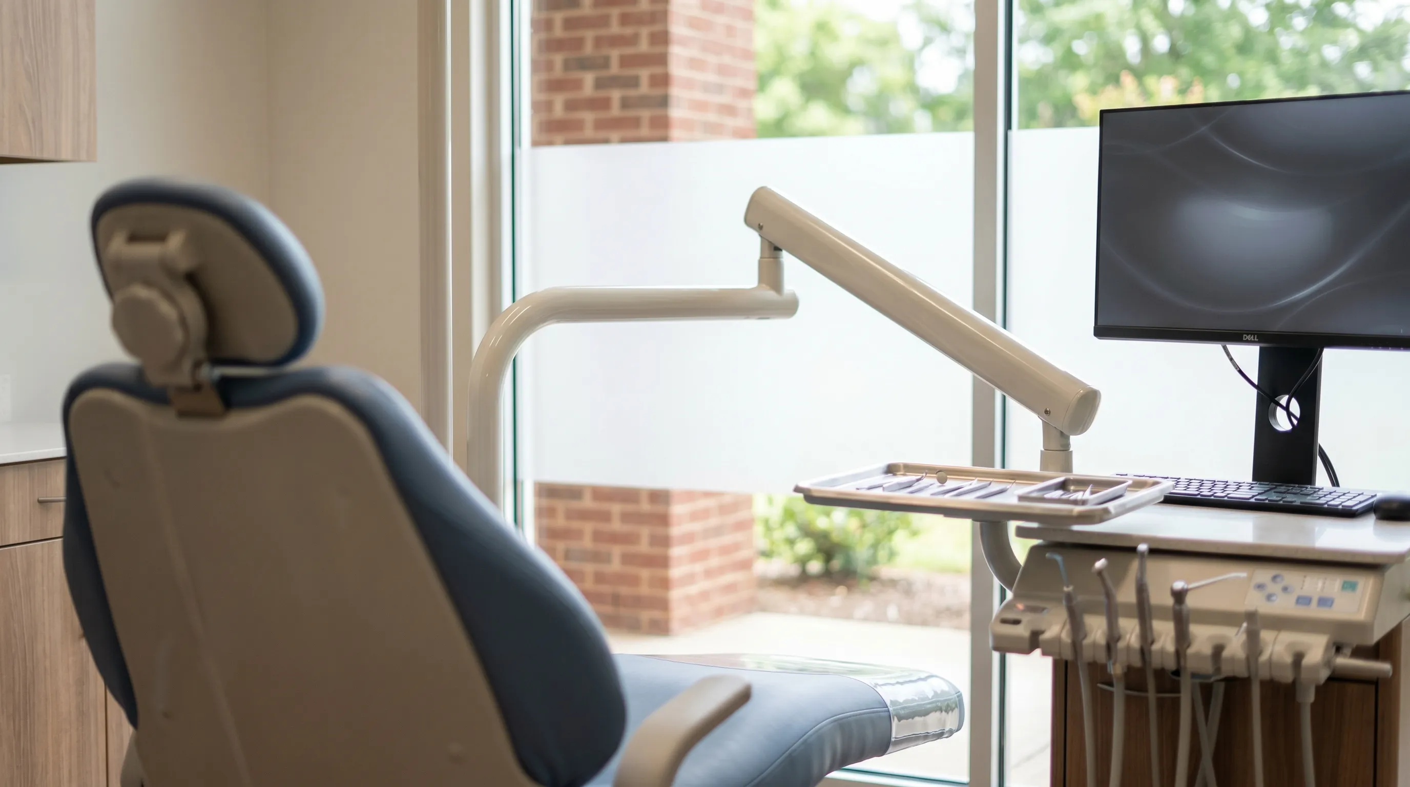 Professional dental hygienist treating a patient in a modern dental office in Tuscaloosa, AL