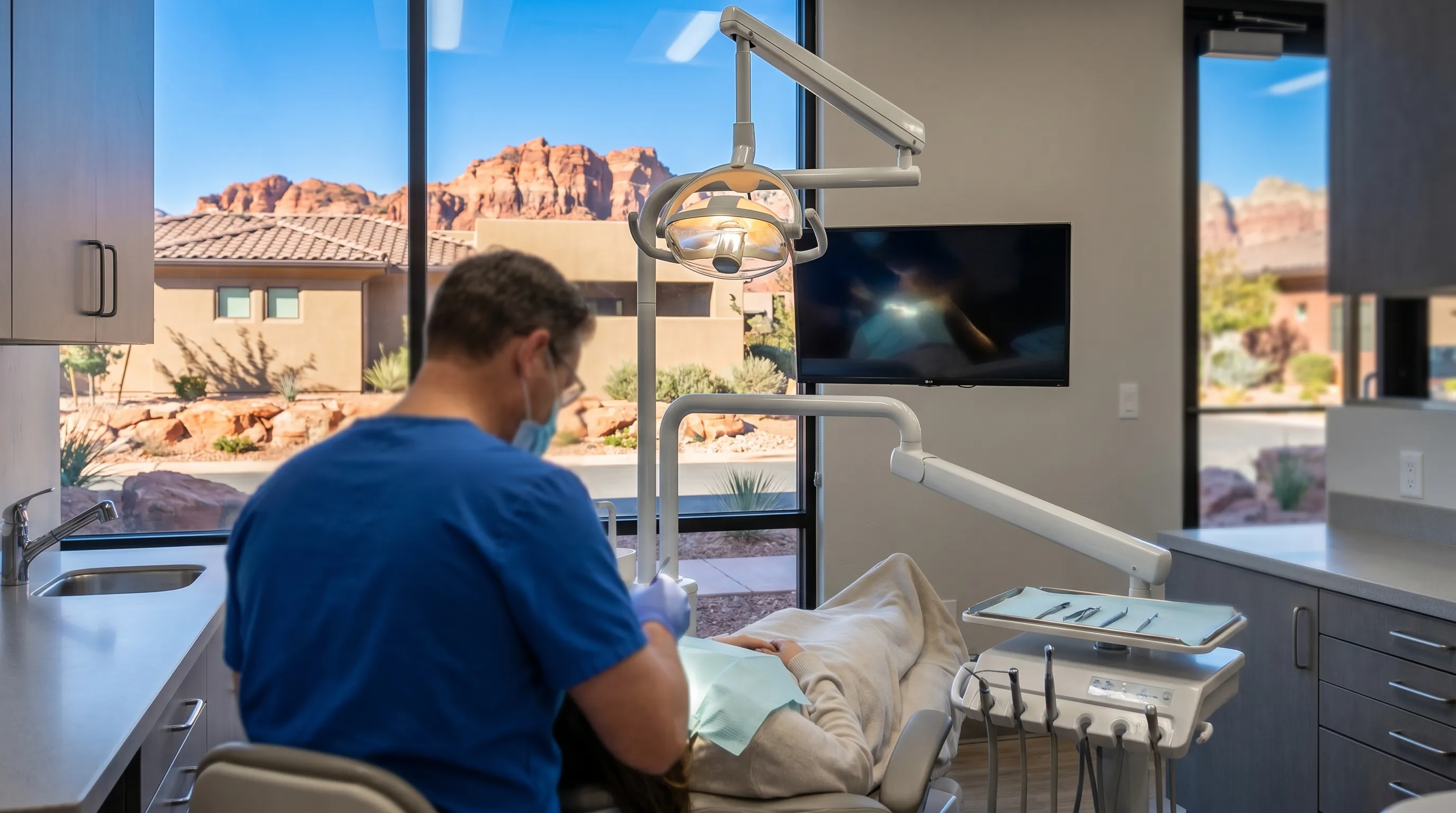 Professional dentist treating a patient in a modern dental operatory in St. George, UT