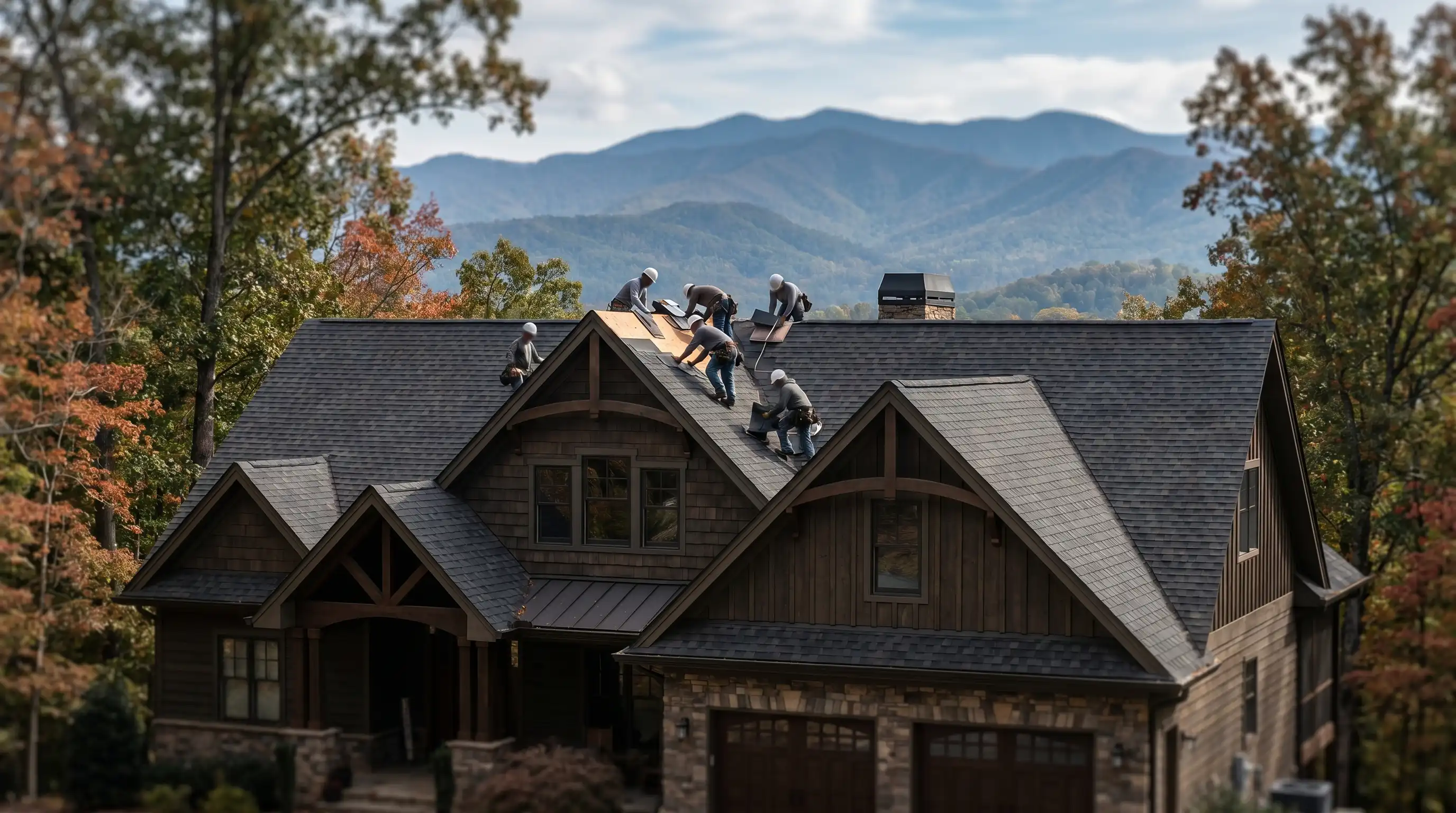 Professional roofing crew installing shingles on a residential home in Asheville, NC, with Blue Ridge Mountain ridgeline visible in background