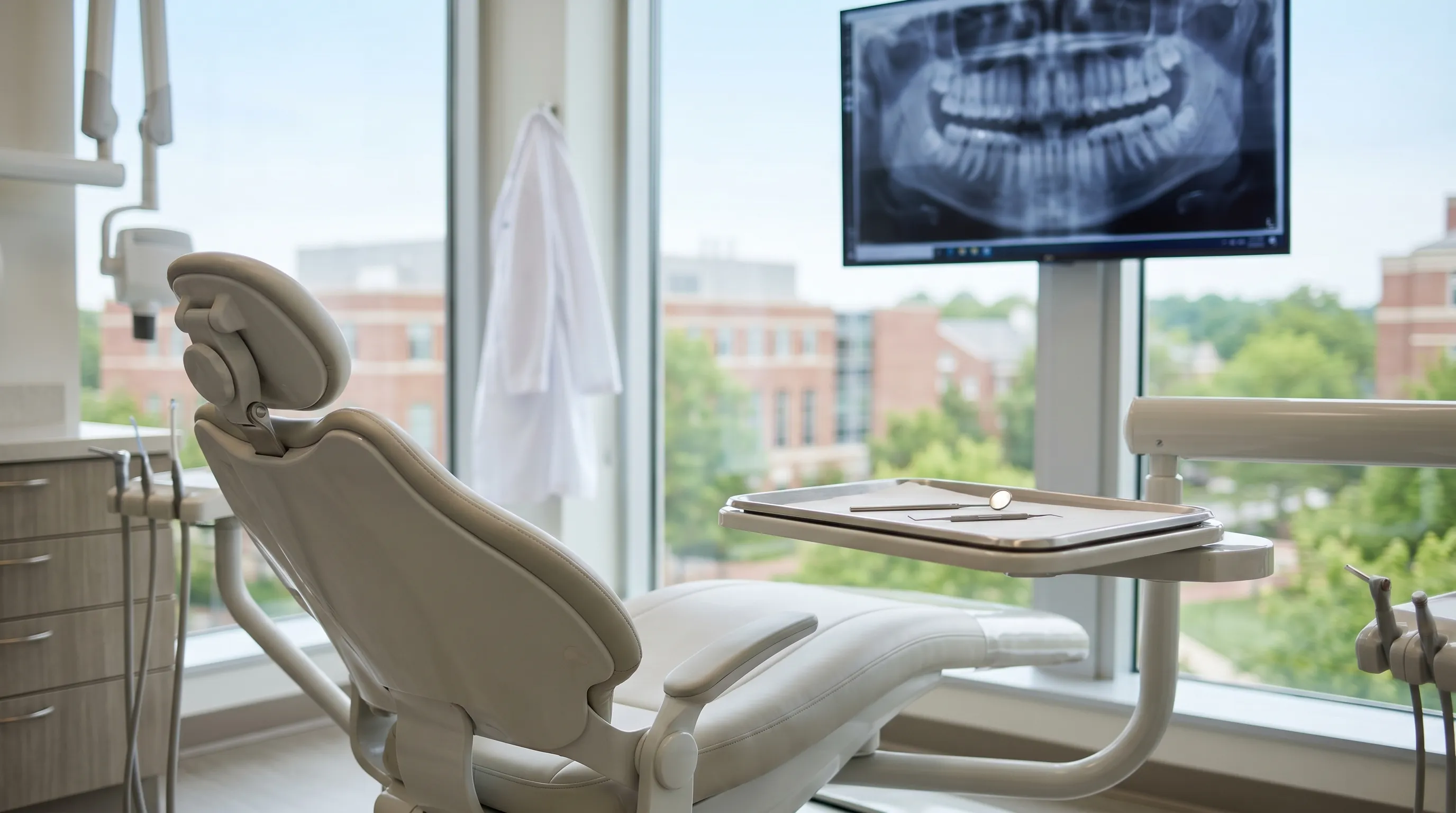 Professional dentist examining a patient in a modern dental practice in Greenville, NC