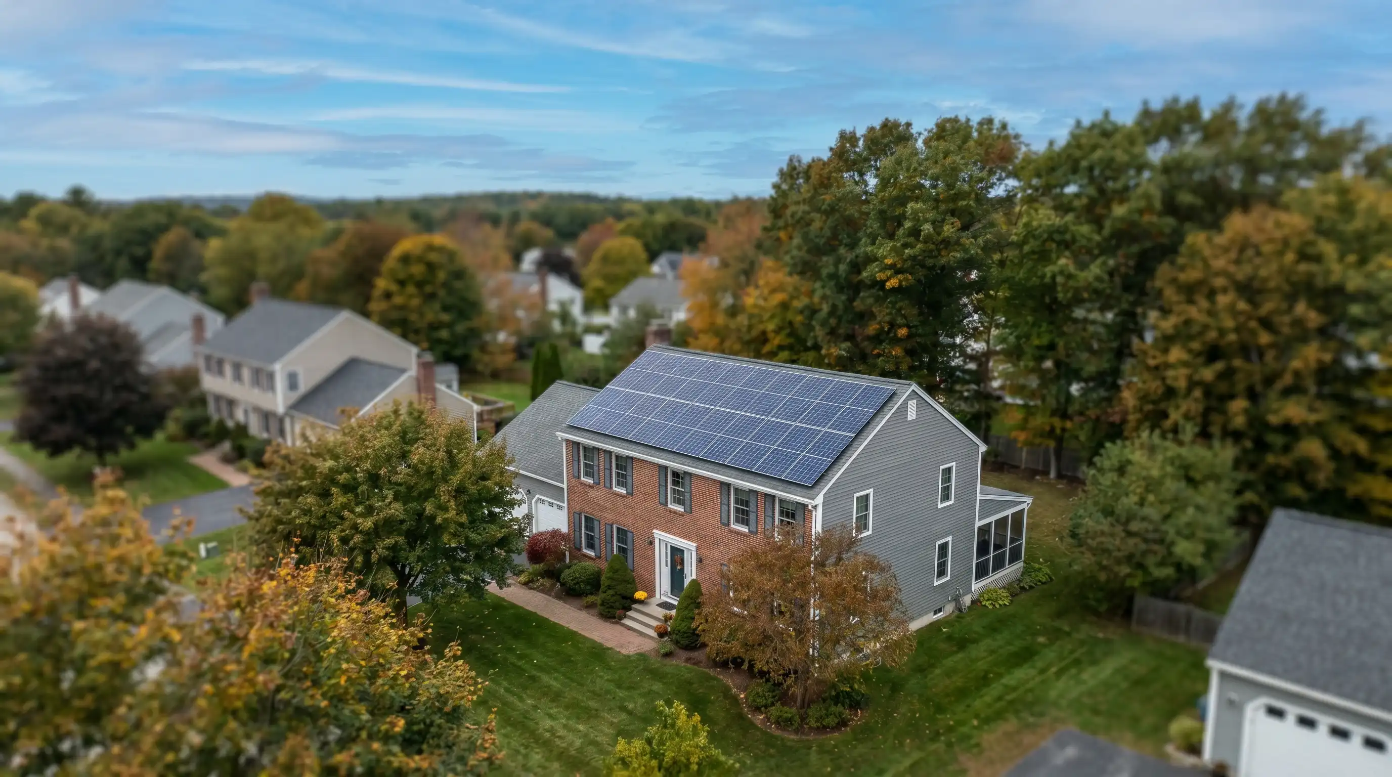 Nashua, NH homeowner reviewing solar energy monitoring dashboard showing production and savings data