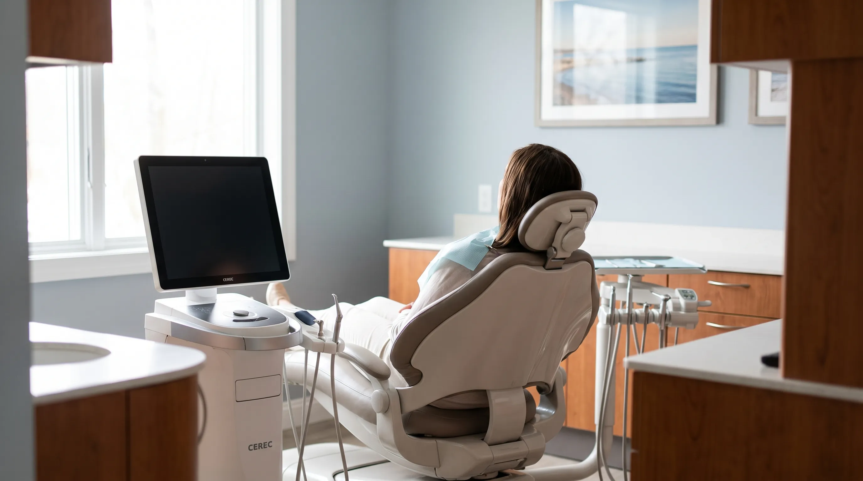 Modern dental operatory in a Norwalk, CT practice with natural light and CEREC digital scanning equipment, reflecting Fairfield County's premium care standards