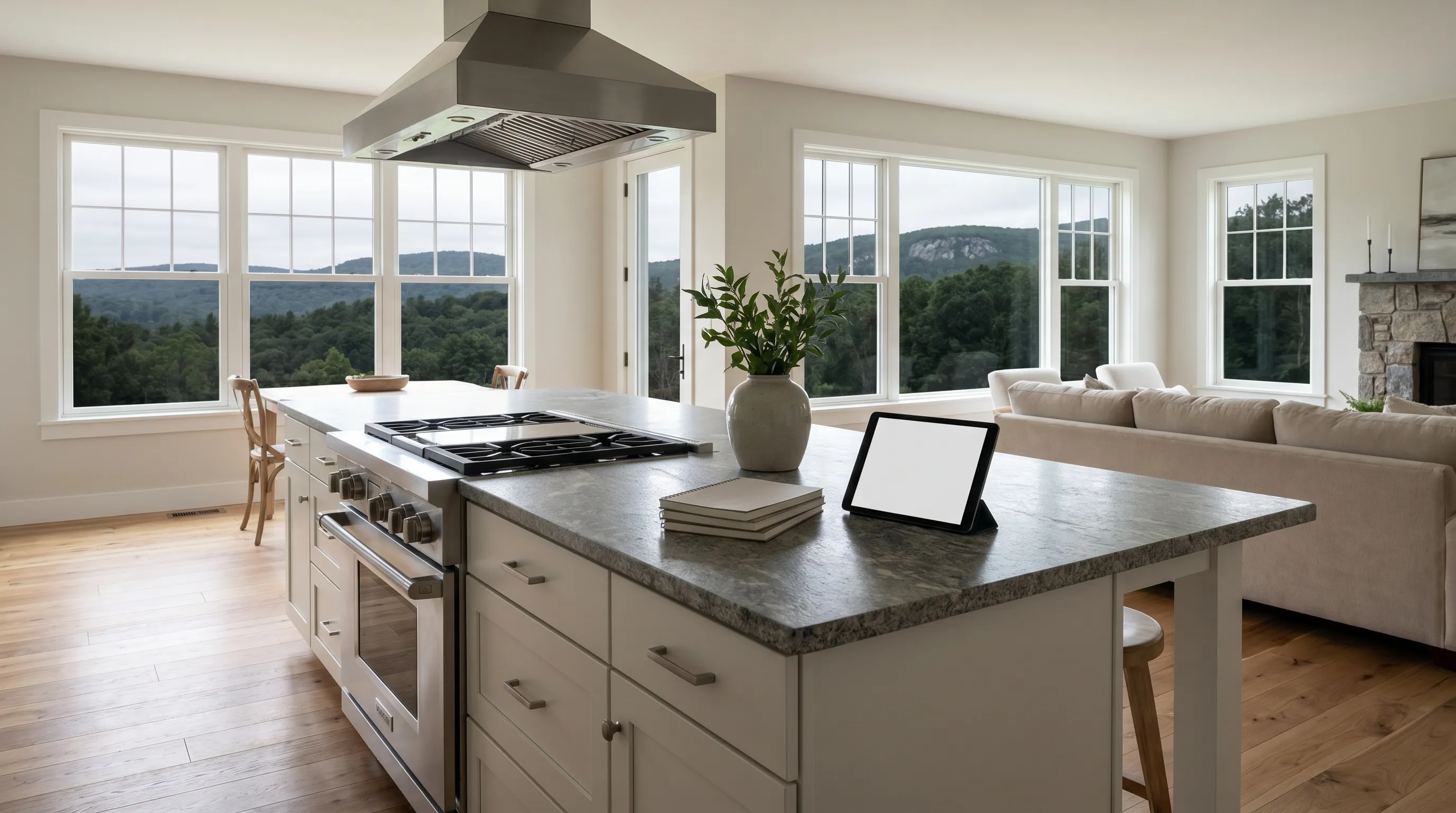 Real estate agent showing a bright renovated colonial home interior to buyers in Danbury, CT