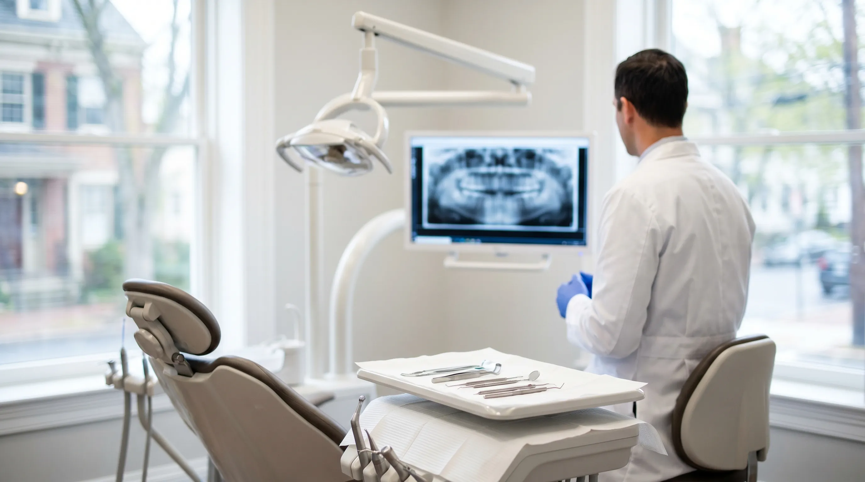 Modern dental office interior with professional dentist reviewing patient records in Bethlehem, PA