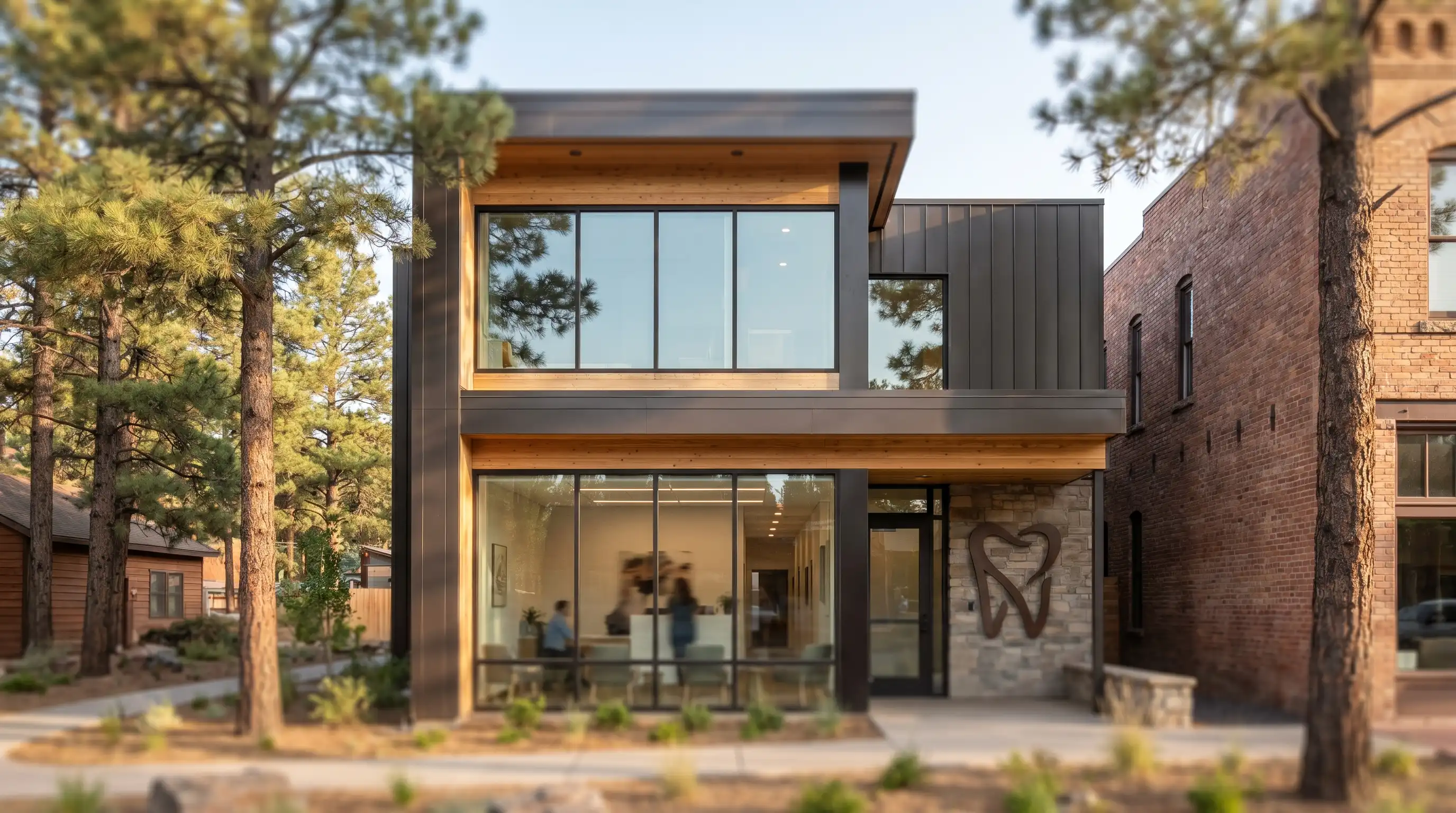 Dentist consulting with a patient in a modern Flagstaff dental practice, with warm wood accents and natural lighting conveying a welcoming local practice