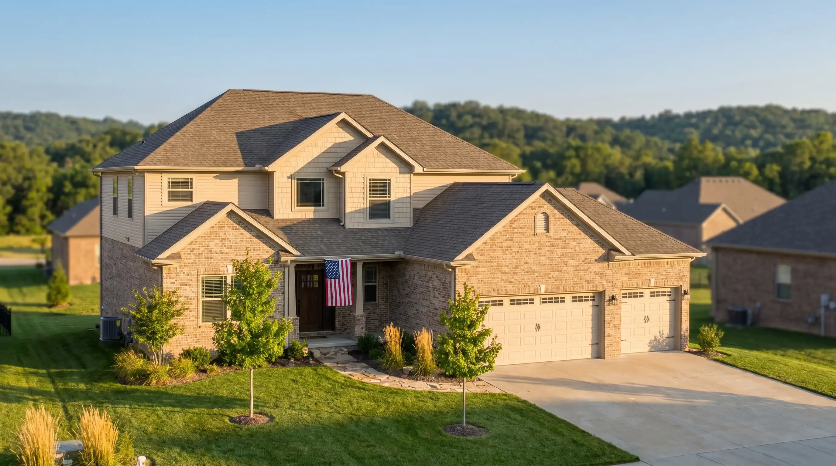 Professional real estate agent welcoming a couple to a two-story brick home in a new Rogers, AR subdivision with Ozark hills visible in the background