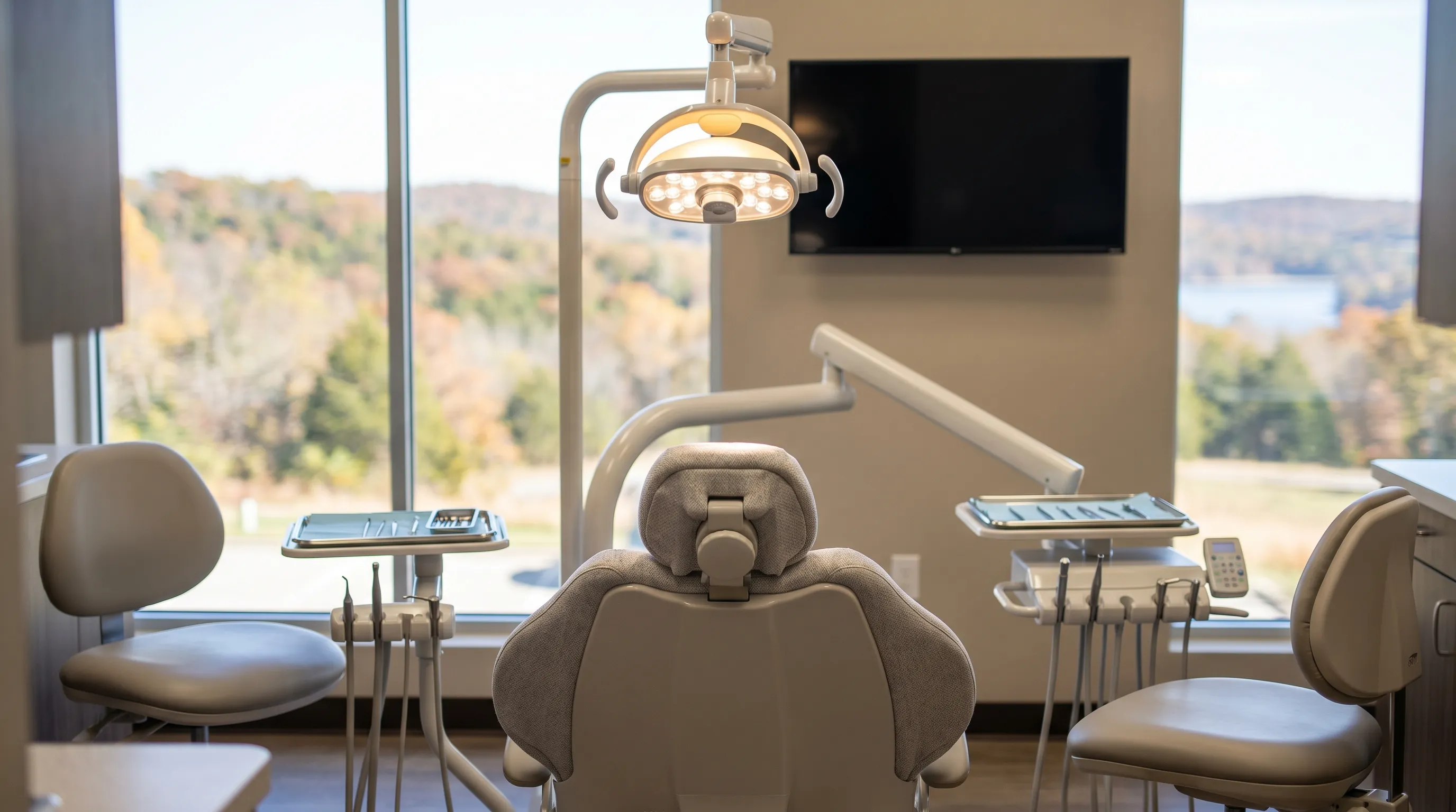 Modern dental office exterior in a professional medical plaza in Rogers, AR with clean white facade and welcoming front entrance under a clear blue sky