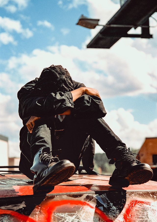 man hunched over in frustration