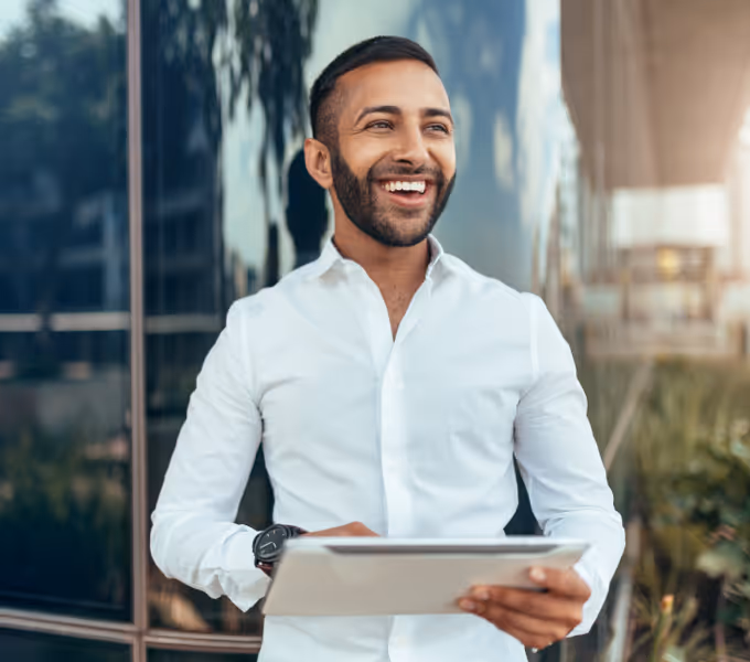 Male engineer type holding a tablet