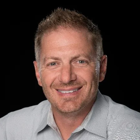 Prompts.ai testimonial from Frank Buscemi CEO and CCO of MBE Group highlighting automated content creation and strategy workflows that enhance creative focus and productivity