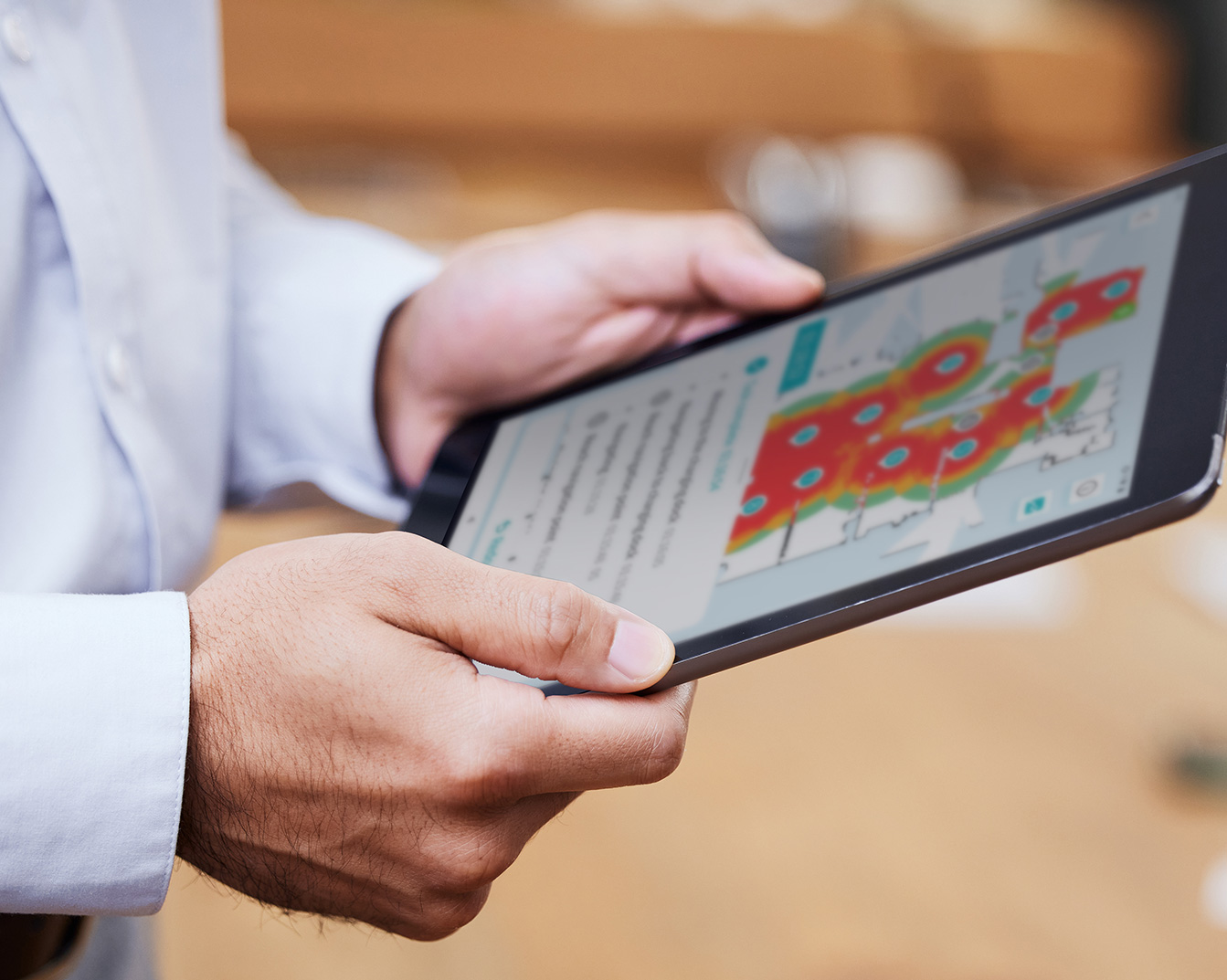 An autonomous robot operator looking at a heat map on a tablet